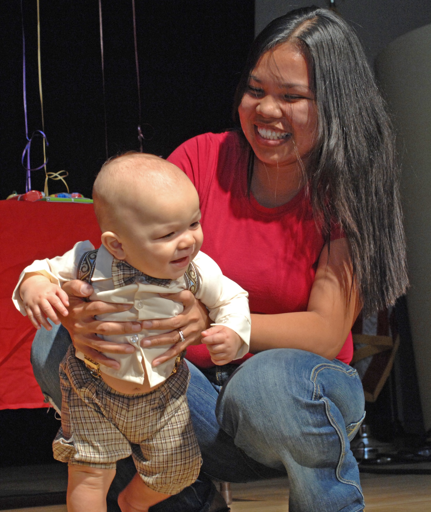 SPANGDAHLEM AIR BASE, Germany – Cristine Doherty poses her 7-month-old son, James, during the “Cutest Little Baby” competition held at the Brick House Sept. 26. James won the 7 to 12-month-old category with 15 out of 43 votes. All 22 babies participating in the event received a gift basket, and the winners of each of the four categories received a $75 gift certificate from the Army and Air Force Exchange Services. (U.S. Air Force photo/Senior Airman Benjamin Wilson)