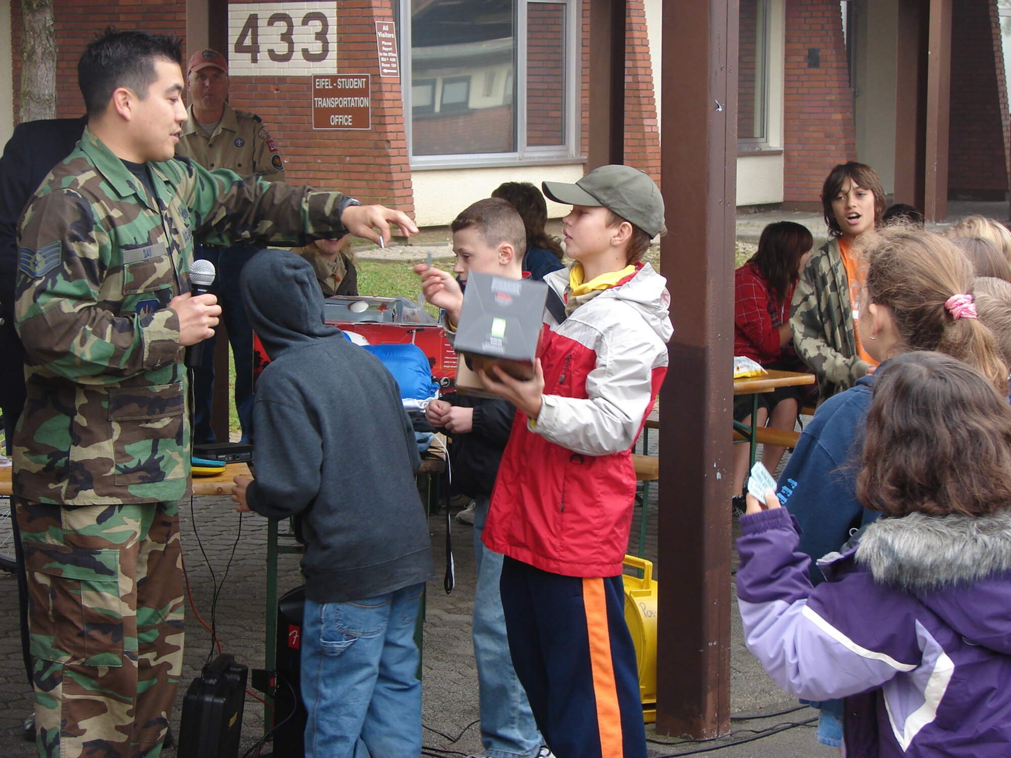 SPANGDAHLEM AIR BASE, Germany – Staff Sgt. Gary Day, 52nd Civil Engineer Squadron fire instructor, calls out raffle numbers during a 2008 National Fire Prevention Week activity at Spangdahlem Air Base. The 2009 Fire Prevention Week will include school visits by Saber firefighters and Sparky, the National Fire Protection Association mascot, as well as a parade at 11 a.m. Oct. 10 starting at the Eifel Lanes Bowling Center, through housing and ending at Spangdahlem Elementary School. (Courtesy photo)