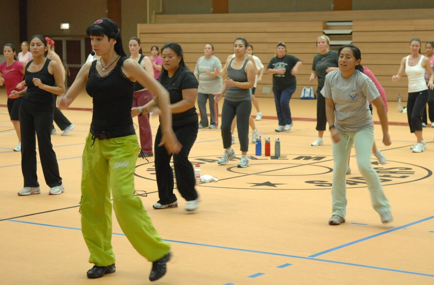 SPANGDAHLEM AIR BASE, Germany – Lisa J. Hamlin, director of international military relations for the Aerobics and Fitness Association of America, instructs a Zumba class at the Skelton Memorial Fitness Center Sept. 25. Zumba is a mixture of latin, hip-hop, and reggaeton. It incorporates dancing and fitness, allowing its users to burn between 700 to 800 calories an hour. (U.S. Air Force photo/Airman 1st Class Staci Miller)