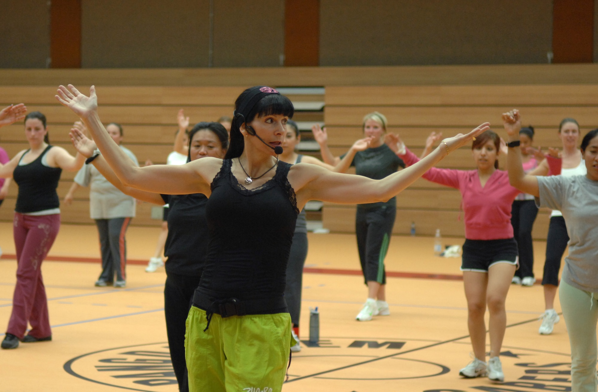 SPANGDAHLEM AIR BASE, Germany – Lisa J. Hamlin, director of international military relations for the Aerobics and Fitness Association of America, instructs a Zumba class at the Skelton Memorial Fitness Center Sept. 25. Zumba is a mixture of latin, hip-hop, and reggaeton. It incorporates dancing and fitness, allowing its users to burn between 700 to 800 calories an hour. (U.S. Air Force photo/Airman 1st Class Staci Miller)