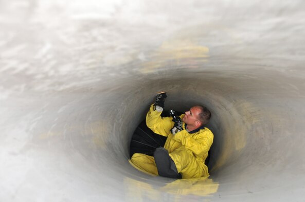 Staff Sgt. Andrew Pechanec, a crewchief with the 8th Aircraft Maintenance Squadron, 35th Aircraft Maintenance Unit, performs an intake inspection on an F-16 Fighting Falcon at Kunsan Air Base, Republic of Korea, Sept. 17. The 35th AMU maintainers inspected about 12 F-16s before the pilots deployed the jets to Eielson Air Force Base, Alaska, for Distant Frontier and Red Flag Alaska. (U.S. Air Force photo/Capt. Shannon Collins)