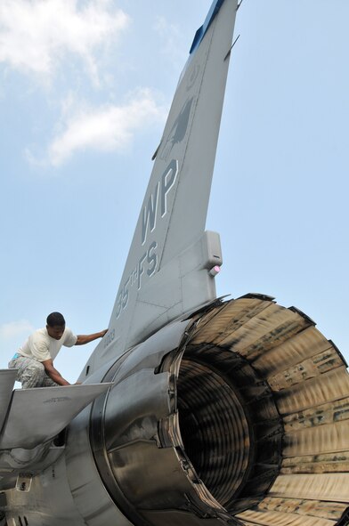 Staff Sgt. Erik Bedenfield, a crewchief with the 8th Aircraft Maintenance Squadron, 35th Aircraft Maintenance Unit, checks the panels as he performs a post flight inspection on an F-16 Fighting Falcon at Kunsan Air Base, Republic of Korea, Sept. 17. The 35th AMU maintainers inspected about 12 F-16s before the pilots deployed the jets to Eielson Air Force Base, Alaska, for Distant Frontier and Red Flag Alaska. (U.S. Air Force photo/Capt. Shannon Collins)