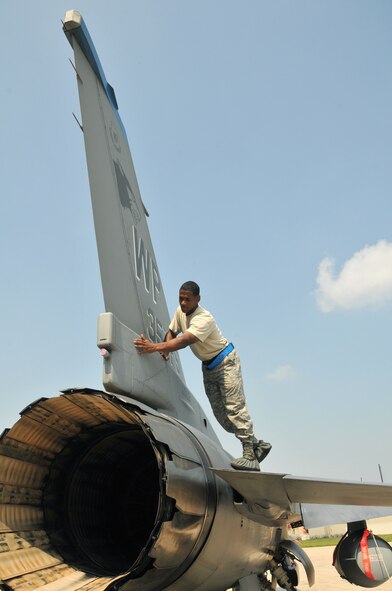 Staff Sgt. Erik Bedenfield, a crewchief with the 8th Aircraft Maintenance Squadron, 35th Aircraft Maintenance Unit, checks the panels as he performs a post flight inspection on an F-16 Fighting Falcon at Kunsan Air Base, Republic of Korea, Sept. 17. The 35th AMU maintainers inspected about 12 F-16s before the pilots deployed the jets to Eielson Air Force Base, Alaska, for Distant Frontier and Red Flag Alaska. (U.S. Air Force photo/Capt. Shannon Collins)