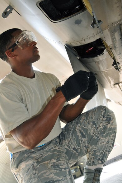 Staff Sgt. Erik Bedenfield, a crewchief with the 8th Aircraft Maintenance Squadron, 35th Aircraft Maintenance Unit, performs a post flight inspection on an F-16 Fighting Falcon at Kunsan Air Base, Republic of Korea, Sept. 17. The 35th AMU maintainers inspected about 12 F-16s before the pilots deployed the jets to Eielson Air Force Base, Alaska, for Distant Frontier and Red Flag Alaska. (U.S. Air Force photo/Capt. Shannon Collins)