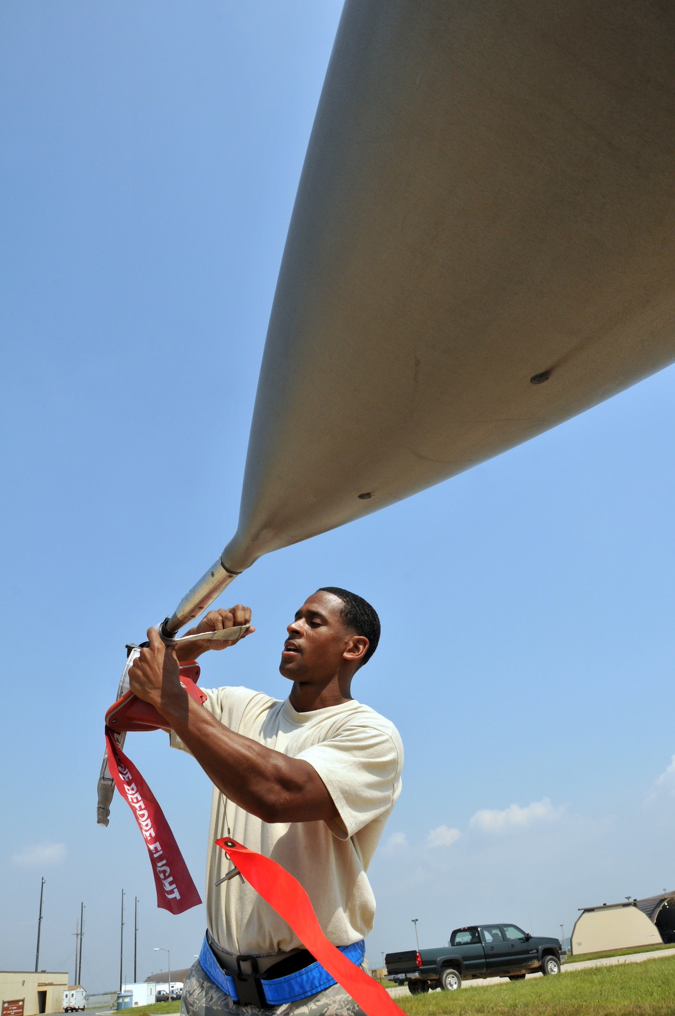 Staff Sgt. Erik Bedenfield, a crewchief with the 8th Aircraft Maintenance Squadron, 35th Aircraft Maintenance Unit, secures an F-16 Fighting Falcon and performs a post flight inspection at Kunsan Air Base, Republic of Korea, Sept. 17. The 35th AMU maintainers inspected about 12 F-16s before the pilots deployed the jets to Eielson Air Force Base, Alaska, for Distant Frontier and Red Flag Alaska. (U.S. Air Force photo/Capt. Shannon Collins)