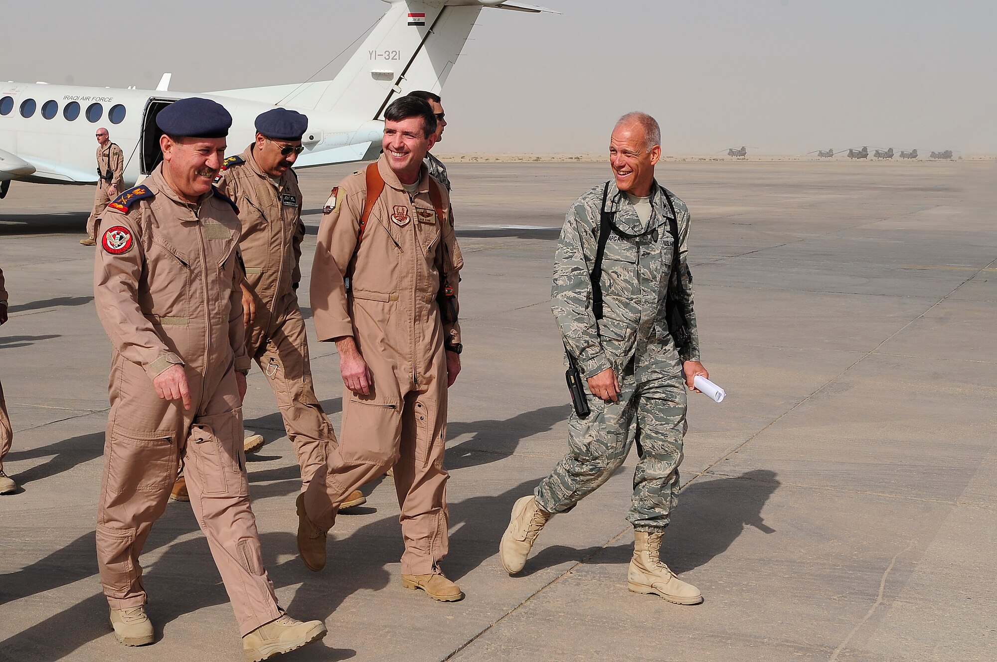 ALI BASE, Iraq - (left to right), Staff Lt. Gen. Anwar Hamad Amen Ahmed Iraq Air Force Commander, U.S. Air Force Maj. Gen. Robert Kane, director, Iraq Training and Advisory Mission – Air Force, and Col. Glen A. Apgar, 407th Air Expeditionary Group commander, converse during the two general’s visit here, Sept. 24, 2009. This was the first joint visit General Ahmed and General Kane, and marked a significant step in providing the Iraqi Air Force with a better understanding of what assets will be available to support them here when the base is transitioned to the Government of Iraq. (U.S. Air Force photo/Senior Airman Tony R. Ritter)