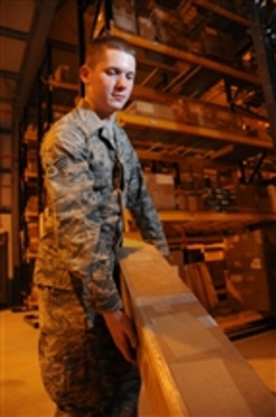 U.S. Air Force Senior Airman Dustin Long, a consolidated aircraft parts store technician with the 379th Expeditionary Logistics Readiness Squadron, prepares a supply order at a location in Southwest Asia on Sept. 23, 2009.  The consolidated aircraft parts store provides around-the-clock support to airframes and maintains more than 9,000 critical aircraft assets.  