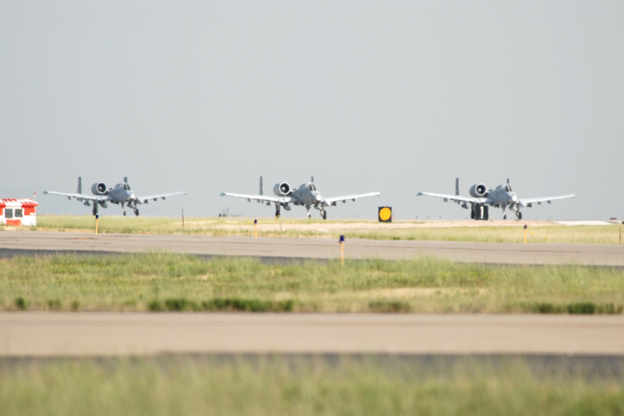 Three 47th Fighter Squadron A-10 Thunderbolt II aircraft line up for takeoff in support of Patriot Rifle III, Hill Air Force Base, Utah, on September 13, 2009. More than 54 members of the 917th Wing from Barksdale Air Force Base, La., and six aircraft participated in the exercise. (U.S. Air Force photo/Master Sgt. Greg Steele)