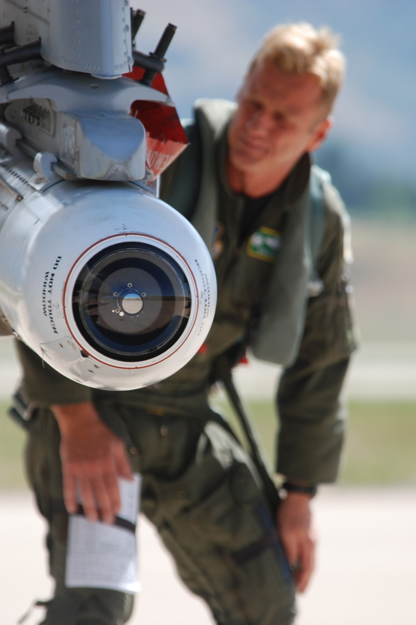Lt. Col. Rodney Glass, 45th Fighter Squadron, commander, performs a pre-flight inspection of an AGM-65 Maverick missile in preparation for a sortie in support of Patriot Rifle III, Hill Air Force Base, Utah, on September 12, 2009. More than 54 members of the 917th Wing from Barksdale Air Force Base, La., and six aircraft participated in the exercise. (U.S. Air Force photo/Master Sgt. Greg Steele)