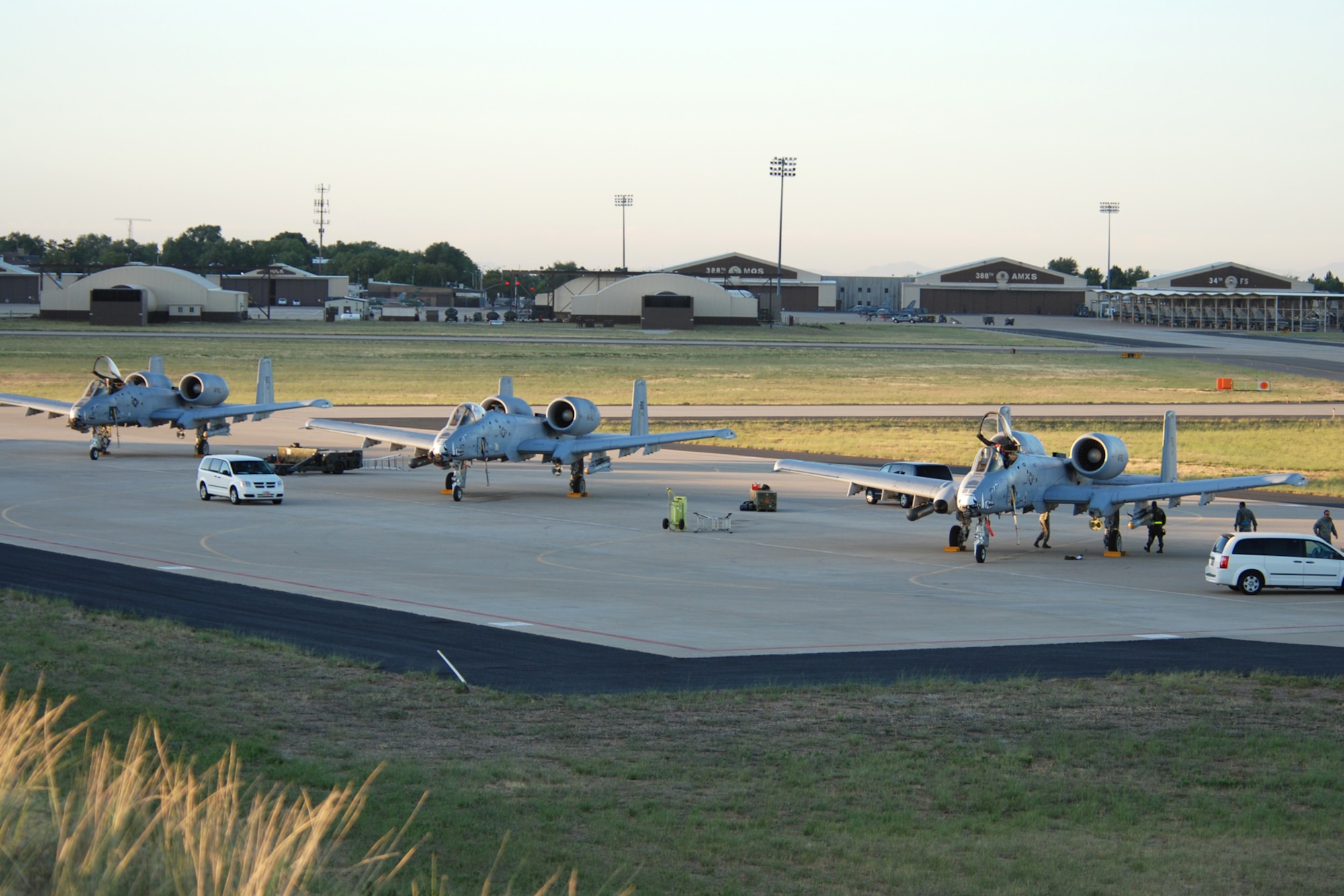 The sun rises on three 47th Fighter Squadron A-10 Thunderbolt II aircraft as maintenance personnel prepare them for the morning sorties to the Utah Test and Training Range in support of Patriot Rifle III, Hill Air Force Base, Utah, on September 12, 2009. More than 54 members of the 917th Wing from Barksdale Air Force Base, La., and six aircraft participated in the exercise. (U.S. Air Force photo/Master Sgt. Greg Steele)

