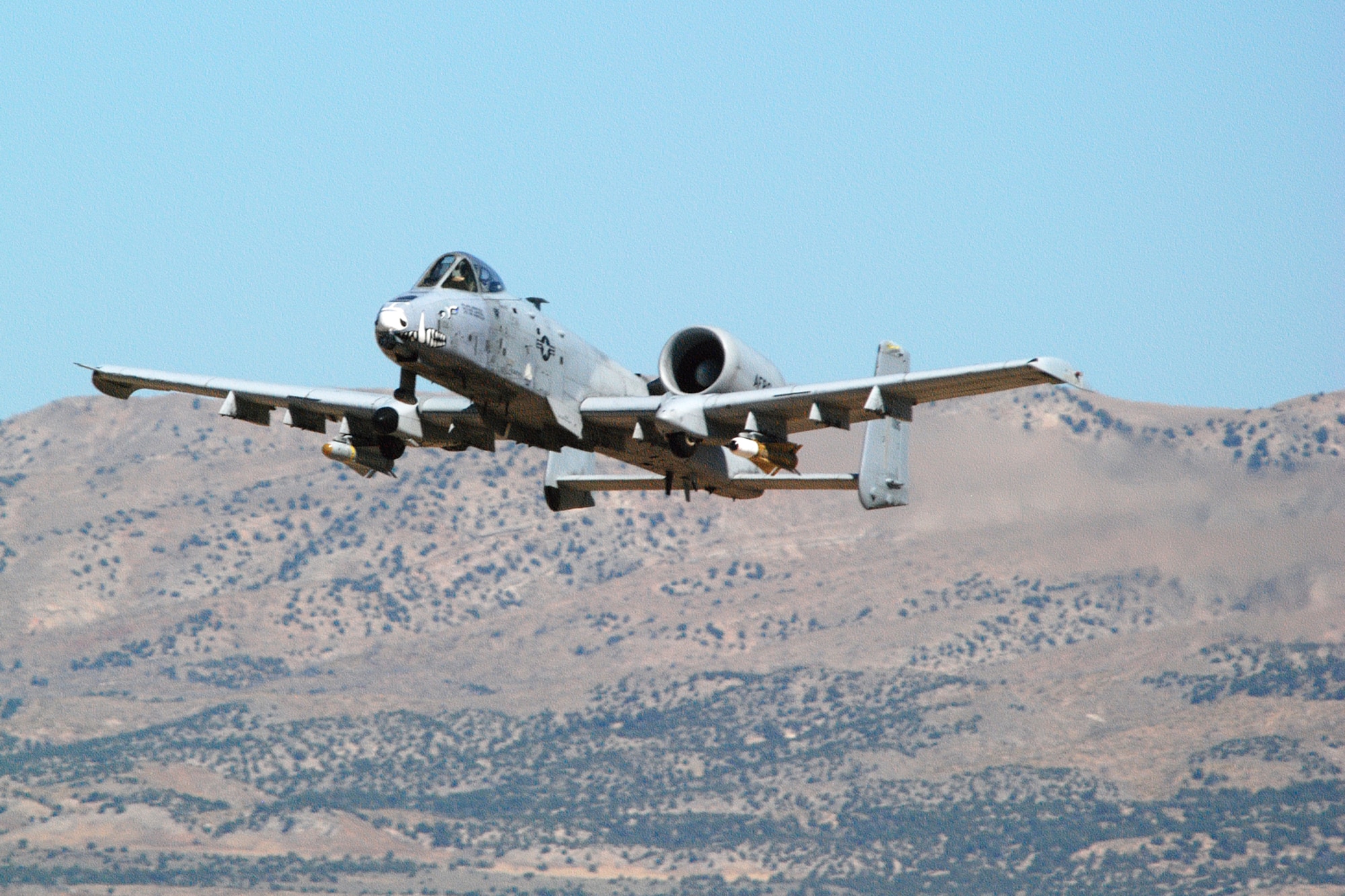 A 47th Fighter Squadron A-10 Thunderbolt II aircraft simulates a 30mm strafing attack on an enemy position at the Utah Test and Training Range in support of Patriot Rifle III, Hill Air Force Base, Utah, on September 11, 2009. More than 54 members of the 917th Wing from Barksdale Air Force Base, La., and six aircraft participated in the exercise. (U.S. Air Force photo/Master Sgt. Greg Steele)