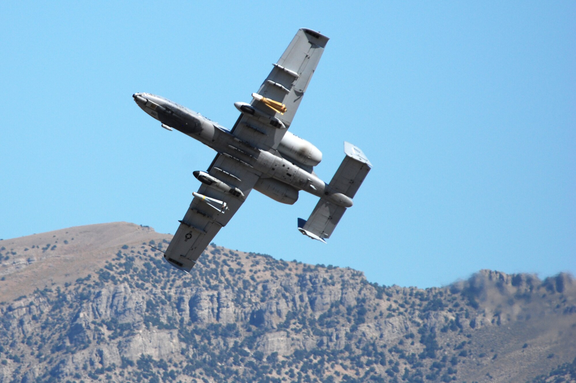 A 47th Fighter Squadron A-10 Thunderbolt II aircraft simulates a 30mm strafing attack on an enemy position at the Utah Test and Training Range in support of Patriot Rifle III, Hill Air Force Base, Utah, on September 11, 2009. More than 54 members of the 917th Wing from Barksdale Air Force Base, La., and six aircraft participated in the exercise. (U.S. Air Force photo/Master Sgt. Greg Steele)