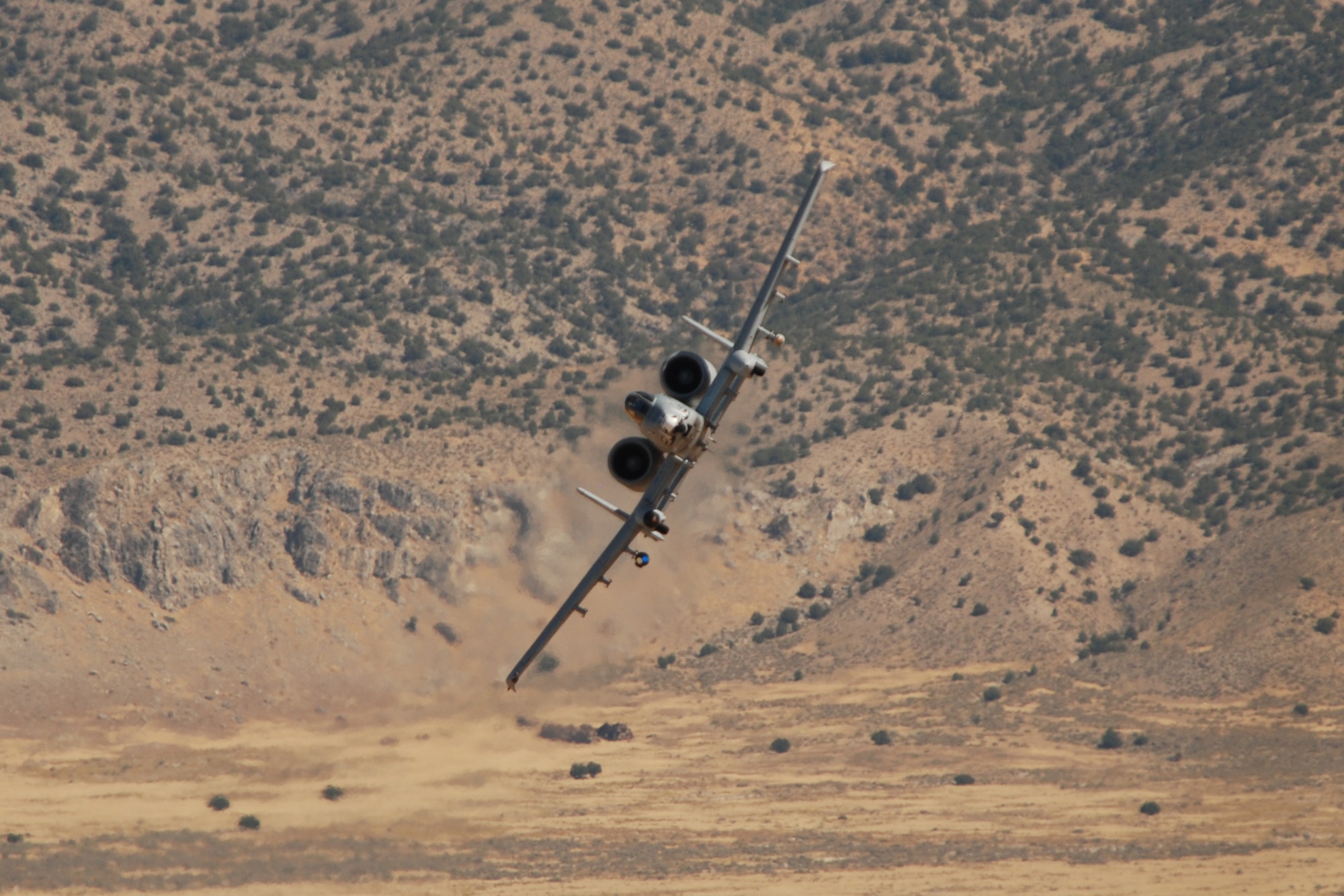 A 47th Fighter Squadron A-10 Thunderbolt II aircraft simulates a 30mm strafing attack on an enemy position at the Utah Test and Training Range in support of Patriot Rifle III, Hill Air Force Base, Utah, on September 11, 2009. More than 54 members of the 917th Wing from Barksdale Air Force Base, La., and six aircraft participated in the exercise. (U.S. Air Force photo/Master Sgt. Greg Steele)