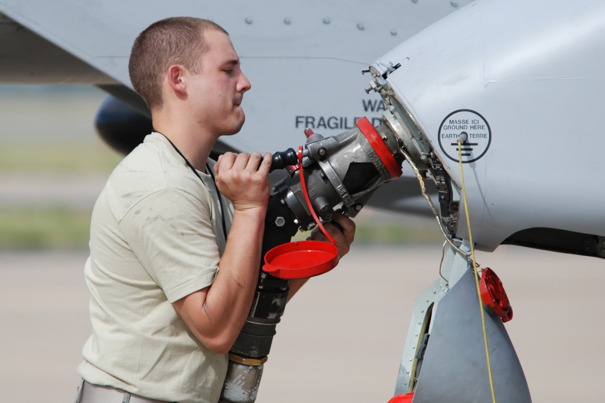 Senior Airman Allen LeBlanc, crew chief, 717th Aircraft Maintenance Squadron, connects a single-point refueling nozzle to a 47th Fighter Squadron A-10 Thunderbolt II in support of Patriot Rifle III, Hill Air Force Base, Utah, on September 10, 2009. More than 54 members of the 917th Wing from Barksdale Air Force Base, La., and six aircraft participated in the exercise. (U.S. Air Force photo/Master Sgt. Greg Steele)