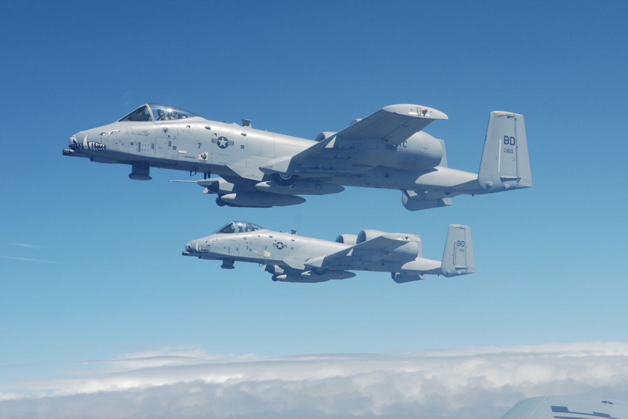 A pair of 47th Fighter Squadron A-10 Thunderbolt II aircraft fly alongside a KC-135 tanker after completing an in-air refueling while enroute to Hill Air Force Base, Utah, in support of Patriot Rifle III, on September 9, 2009. More than 54 members of the 917th Wing from Barksdale Air Force Base, La., and six aircraft participated in the exercise. (U.S. Air Force photo/Master Sgt. Greg Steele)