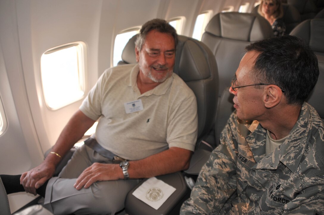 Tech. Sgt. Daniel Oliver, public affairs specialist, talks to a special visitor aboard the C-40 plane and learns more background information for a story he is working on.  Sergeant Oliver is part of the 932nd Airlift Wing headquarters staff at Scott Air Force Base.  (U.S. Air Force photo by Tech. Sgt. Gerald Sonnenberg)