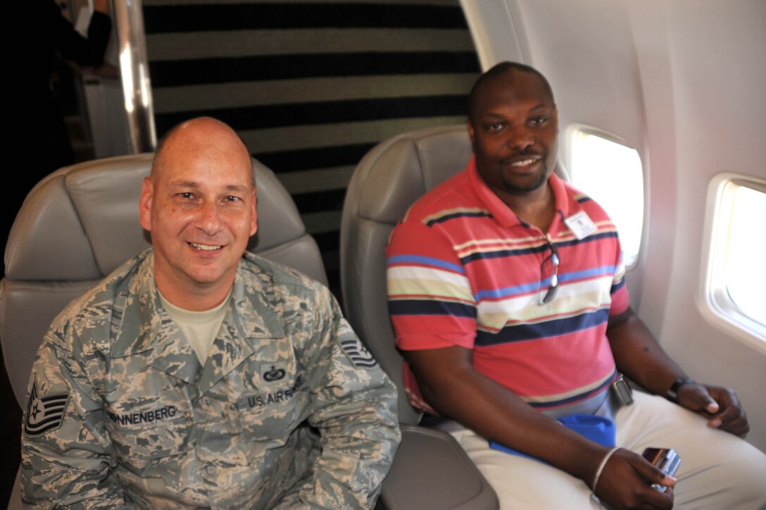 Technical Sergeant Gerald Sonnenberg sits with an employer of Reservists aboard a recent Boss Day flight at the 932nd Airlift Wing, the only Air Force Reserve Command flying wing in Illinois.  (U.S. Air Force photo/Maj. Stan Paregien)