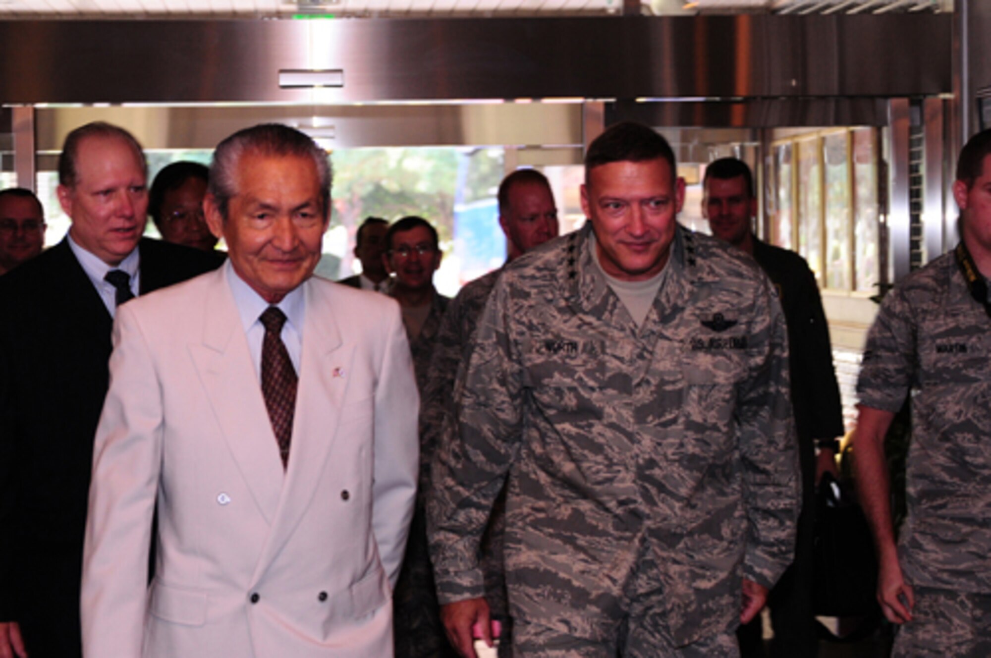 YOKOTA AIR BASE, Japan -- Gen. Gary North, Pacific Air Forces Commander, arrives the base's officers' club with Kouuemon Ishizuka, Mizuho Town mayor, for a civic leader luncheon Sept. 24 during the general's first visit here since he took the reins of PACAF on Aug. 19. The general toured base facilities, hosted an Airman's Call and was the guest speaker at the base's Air Force Anniversary Ball during his visit. (U.S. Air Force photo/Airman 1st Class Michael Dillon)