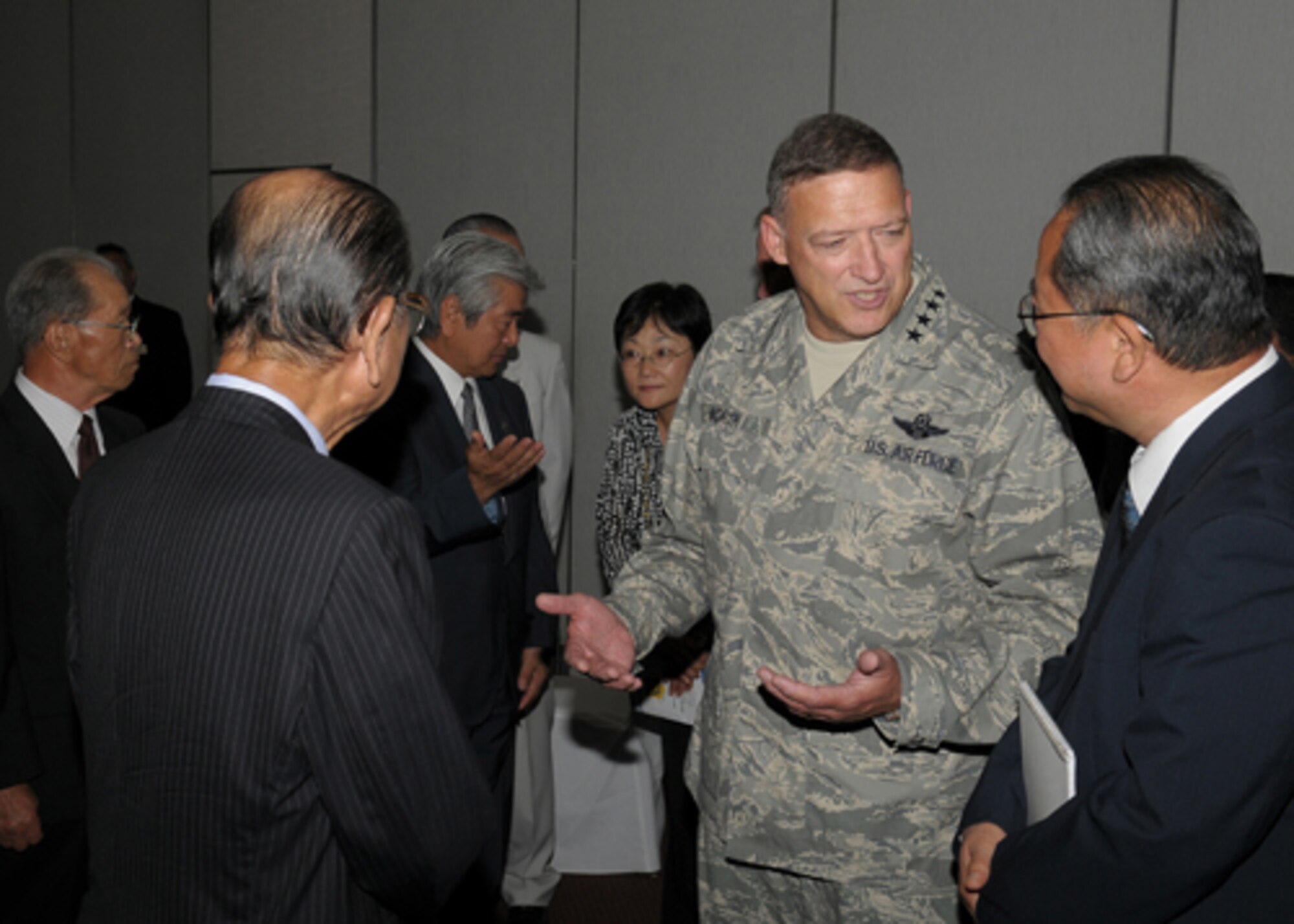 YOKOTA AIR BASE, Japan -- Gen. Gary North, Pacific Air Forces Commander, speaks with Yahachiro Ishikawa, Fussa-Yokota Goodwill Exchange Club president, (left) and Masao Abe, 374th Airlift Wing Public Affairs Office community relations specialist, during a civic leaders' luncheon Sept. 24 during the general's first visit here since he took the reins of PACAF on Aug. 19. The general toured base facilities, hosted an Airman's Call and was the guest speaker at the base's Air Force Anniversary Ball during his visit. (U.S. Air Force photo/Airman 1st Class Sean Martin)