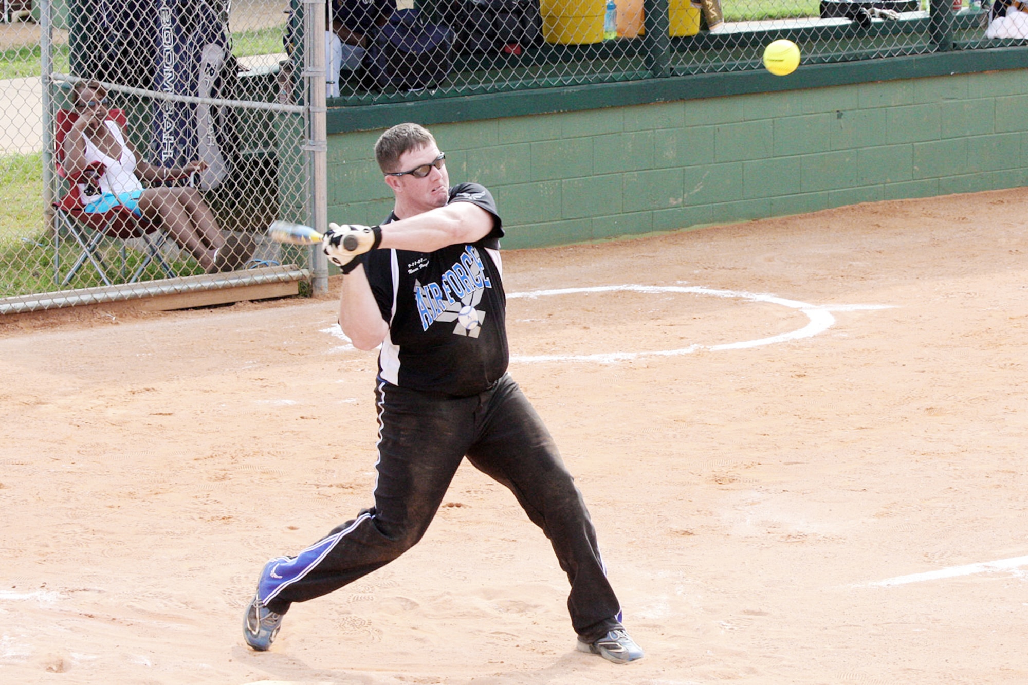 Joshua Wiggs crushes a home run during the Armed Forces Softball Championships Sept. 29, 2009 at Naval Air Station Pensacola, Fla. The Air Force men's and women's softball teams earned gold medals at the event. Wiggs is from Tyndall Air Force Base, Fla. (U.S. Air Force photo/Steve Brown)
