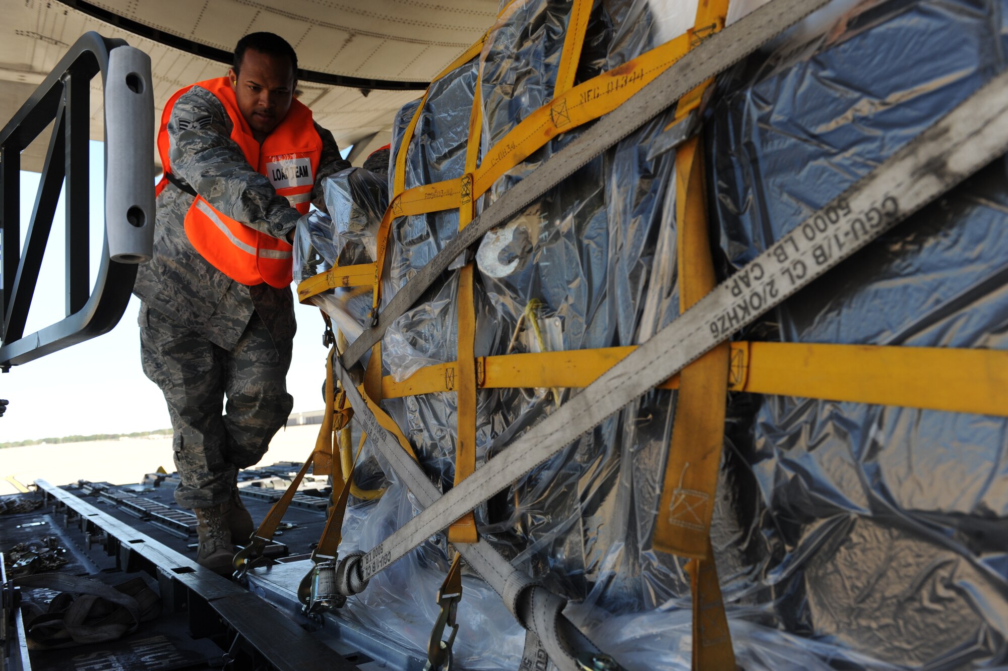 WHITEMAN AIR FORCE BASE, Mo. – Senior Airman Ronald Delabastide, 509th Logistics Readiness Squadron, loads cargo onto a C-130, during the Nuclear Operation Readiness Exercise Sept 28. The NORE is in preparation of the upcoming Nuclear Operational Readiness Inspection Oct. 11. (U.S. Air Force photo/Senior Airman Cory Todd)