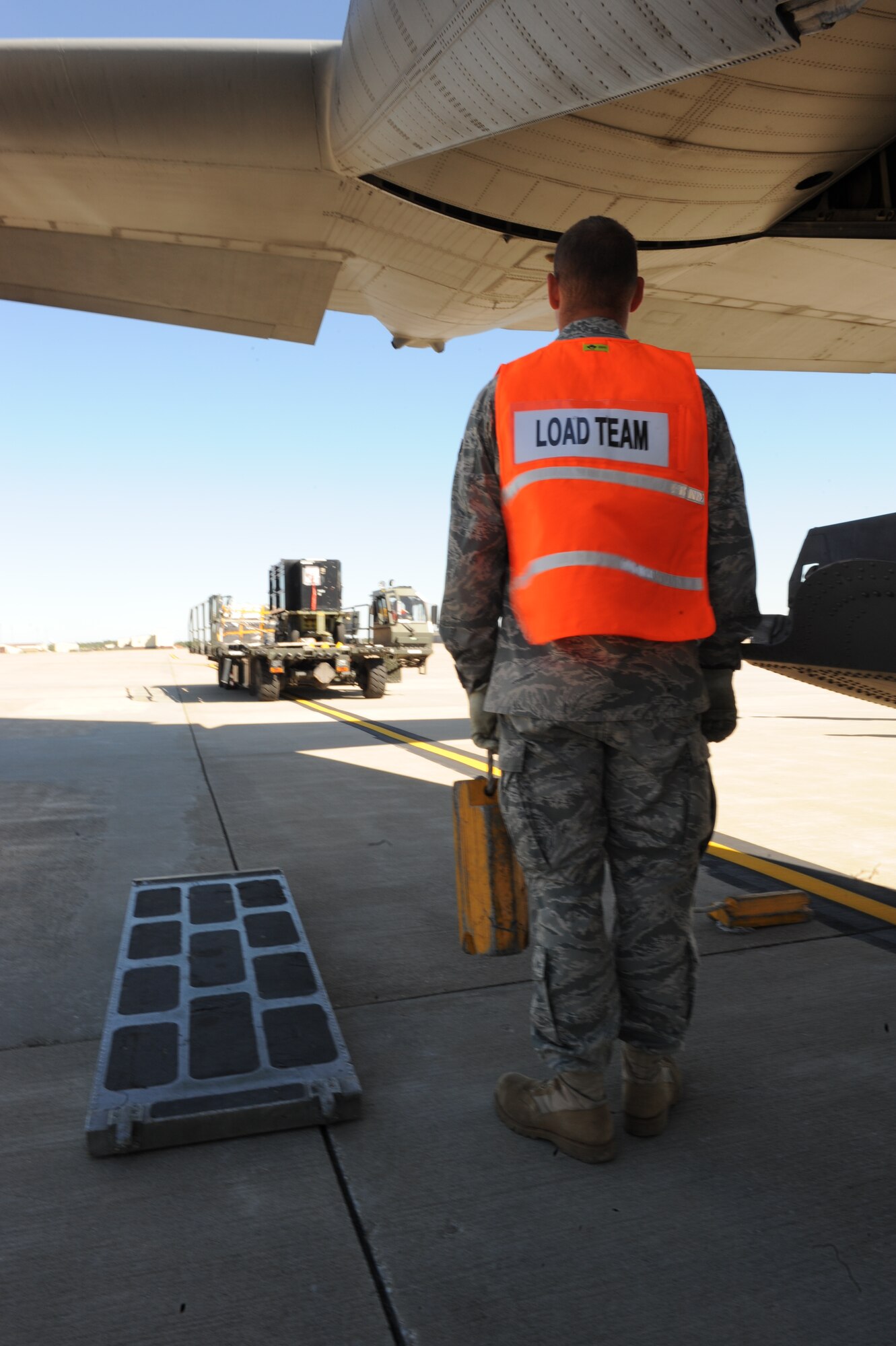 WHITEMAN AIR FORCE BASE, Mo. – Airman 1st Class Samuel Belt, 509th Logistics Readiness Squadron, waits for the cargo to arrive behind the C-130 for chocking, during the Nuclear Operation Readiness Exercise Sept 28. The NORE is in preparation of the upcoming Nuclear Operational Readiness Inspection Oct. 11. (U.S. Air Force photo/Senior Airman Cory Todd)