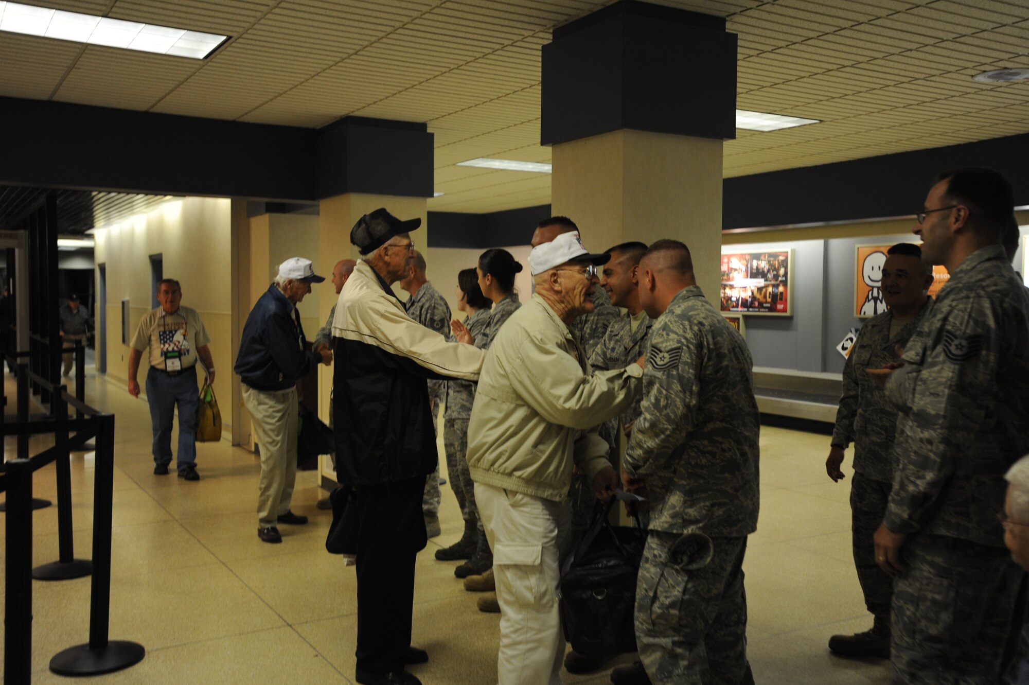 Airmen from Grand Forks Air Force Base, N.D., welcome back the Northern Valley Honor Flight members Sept. 26 at Grand Forks International Airport. The Northern Valley Honor Flight gives World War II veterans a chance to see their memorial as well as other memorials in the nation’s capitol. (U.S. Air Force photo by Staff Sgt. Suellyn F. Nuckolls)