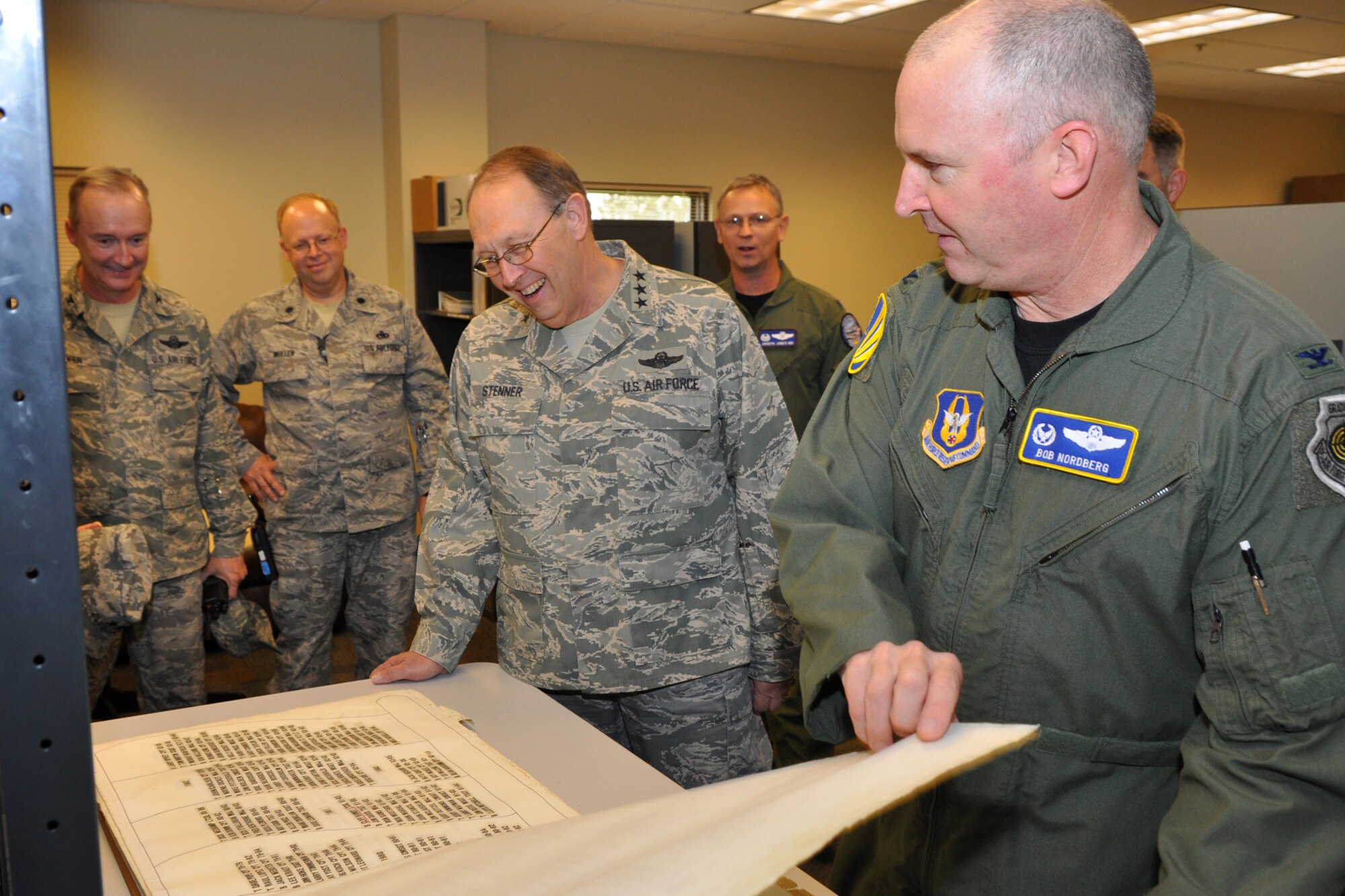 Col. Robert Nordberg, commander, 917th Operations Group, shows Lt. Gen. Charles E. Stenner, Jr., commander, Air Force Reserve Command, the Combat Flight Instructor Course (CFIC) book in the 93rd Bomb Squadron facilities at Barksdale Air Force Base, La., on September 25, 2009. Since the 1950s, every instructor in the B-52s completing the course has signed the book. General Stenner traveled to Barksdale for a meeting with Lt. Gen. Frank Klotz, who is the commander of the Global Strike Command, now headquartered here. While on base, General Stenner also met with Col. Steven Basham, 2nd Bomb Wing, commander, toured the 47th Fighter Squadron facilities, the 93rd Bomb Squadron headquarters building and Hangar 1, where maintenance is accomplished on B-52 Stratofortresses for the 917th Wing. (U.S. Air Force photo/Tech. Sgt. Jeff Walston)