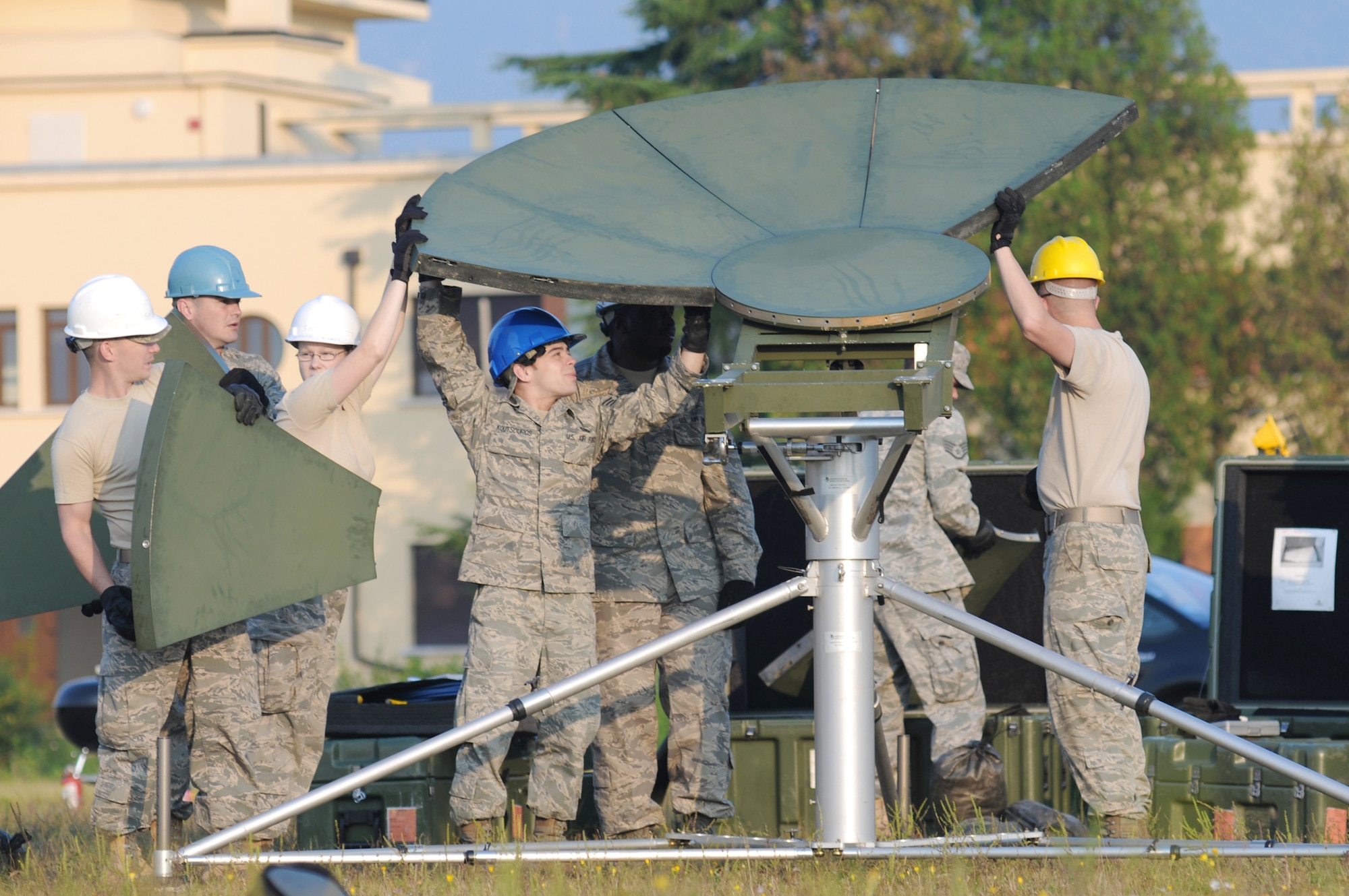 Airmen from the 1st Combat Communications Squadron at Ramstein Air Base, Germany, set up a satellite dish Sept. 22, 2009, during a training exercise at Aviano AB, Italy. The training is in preparation for the largest transformation in the history of Air Force communications when 15 communications Air Force Specialty Codes transition into 11 new cyberspace support specialties.  (U.S. Air Force photo/Staff Sgt. Patrick Dixon)