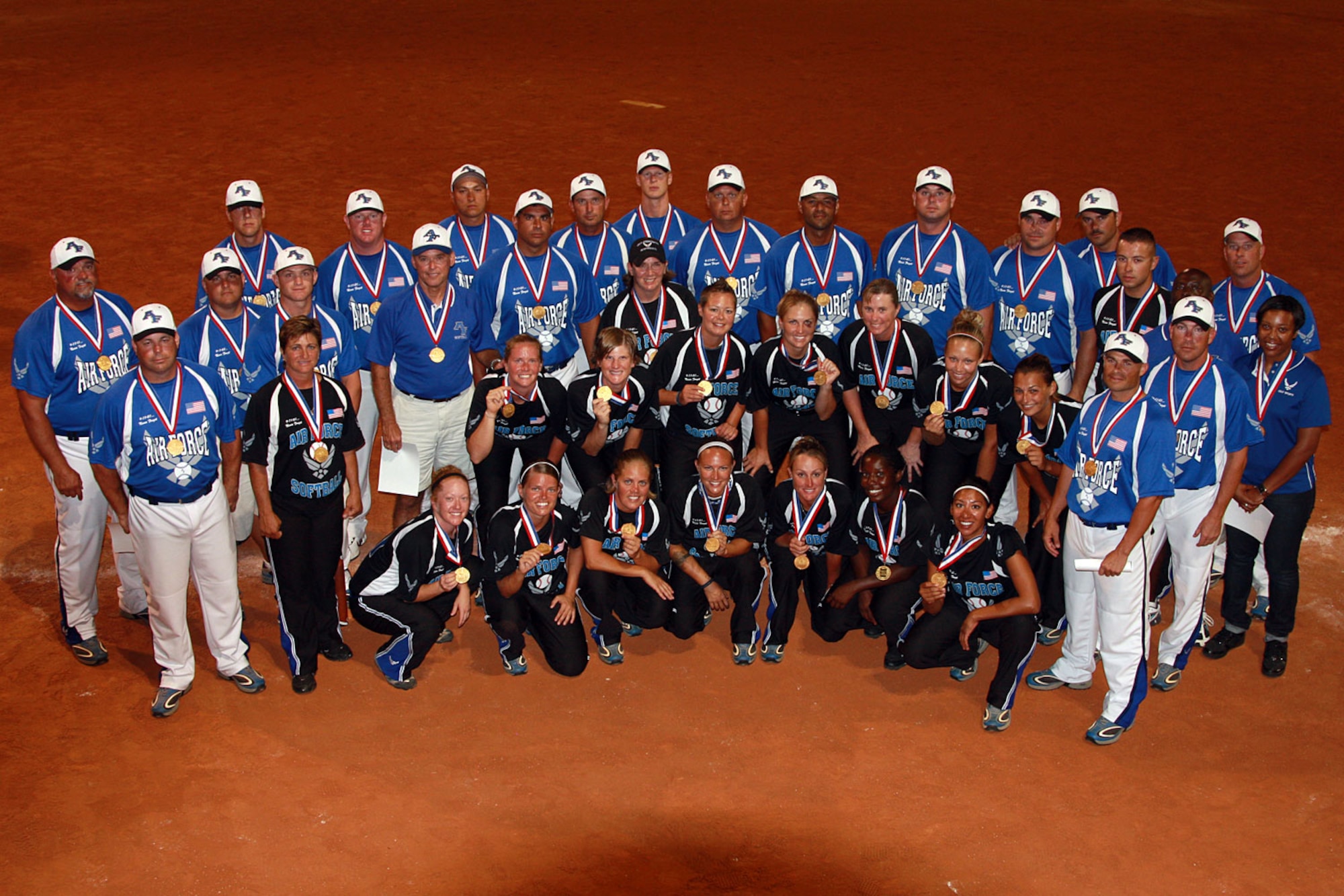 The Air Force men’s and women’s softball teams pose with their gold medals after winning the Armed Forces Slow-Pitch Softball Championships Sept. 25 at Naval Air Station Pensacola, Fla.. (Air Force photo by Steve Brown)