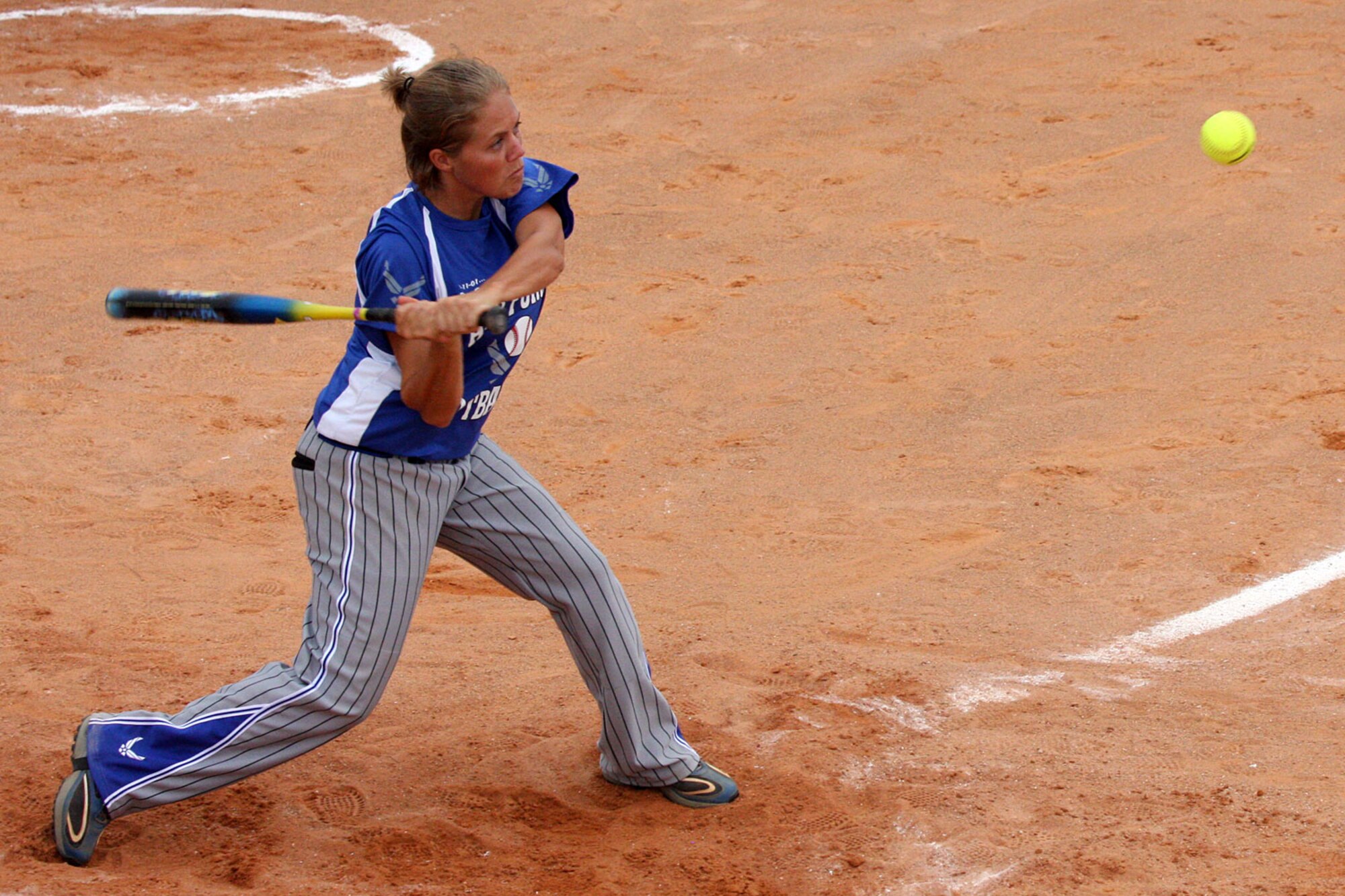 Staff Sgt. Kathy Braun from Offutt Air Force Base, Neb., gets a base hit during the Armed Forces Softball Championships. The Air Force men’s and women’s softball teams earned gold medals at the event. (Air Force photo by Steve Brown)