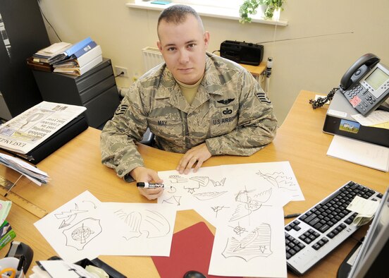 Staff Sgt. Austin May designed a occupational badge, or wings, to be worn by future unmanned aircraft system pilots. Air Force Chief of Staff Gen. Norton Schwartz approved Sergeant May's design. The wings were presented to the graduates of the first Beta class during a ceremony at Creech Air Force Base, Nev., Sept. 25, 2009. Sergeant May is a public affairs craftsman from the 100th Air Refueling Wing, Royal Air Force Mildenhall, England. (U.S. Air Force photo)
