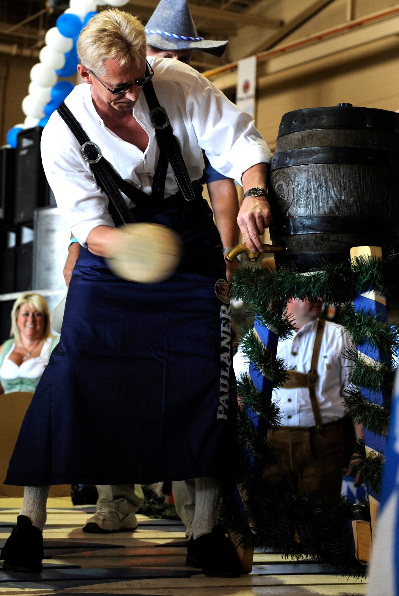 HOLLOMAN AIR FORCE BASE, N.M. -- Col. Peter Klement, German air force Flying Training Center commander, taps the first keg of the evening during the 13th Annual Oktoberfest here, Sept. 26. The German Air Force personnel stationed here invited both servicemembers and civilians to indulge in German music and food. (U.S. Air Force photo by Senior Airman Tiffany Trojca)