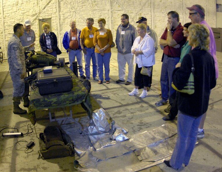 MINOT AIR FORCE BASE, N.D. -- Staff Sgt. Leonard Meadows, 91st Security Forces Group tactical response force team leader, explains sniper techniques and specifications of equipment to members of the League of Cities during the TRF demonstration stop of their tour Sept. 25 here. Group tours such as these continue the growing friendship between Minot AFB and its surrounding communities all across the state. (U.S. Air Force photo by Airman 1st Class Benjamin Stratton)
