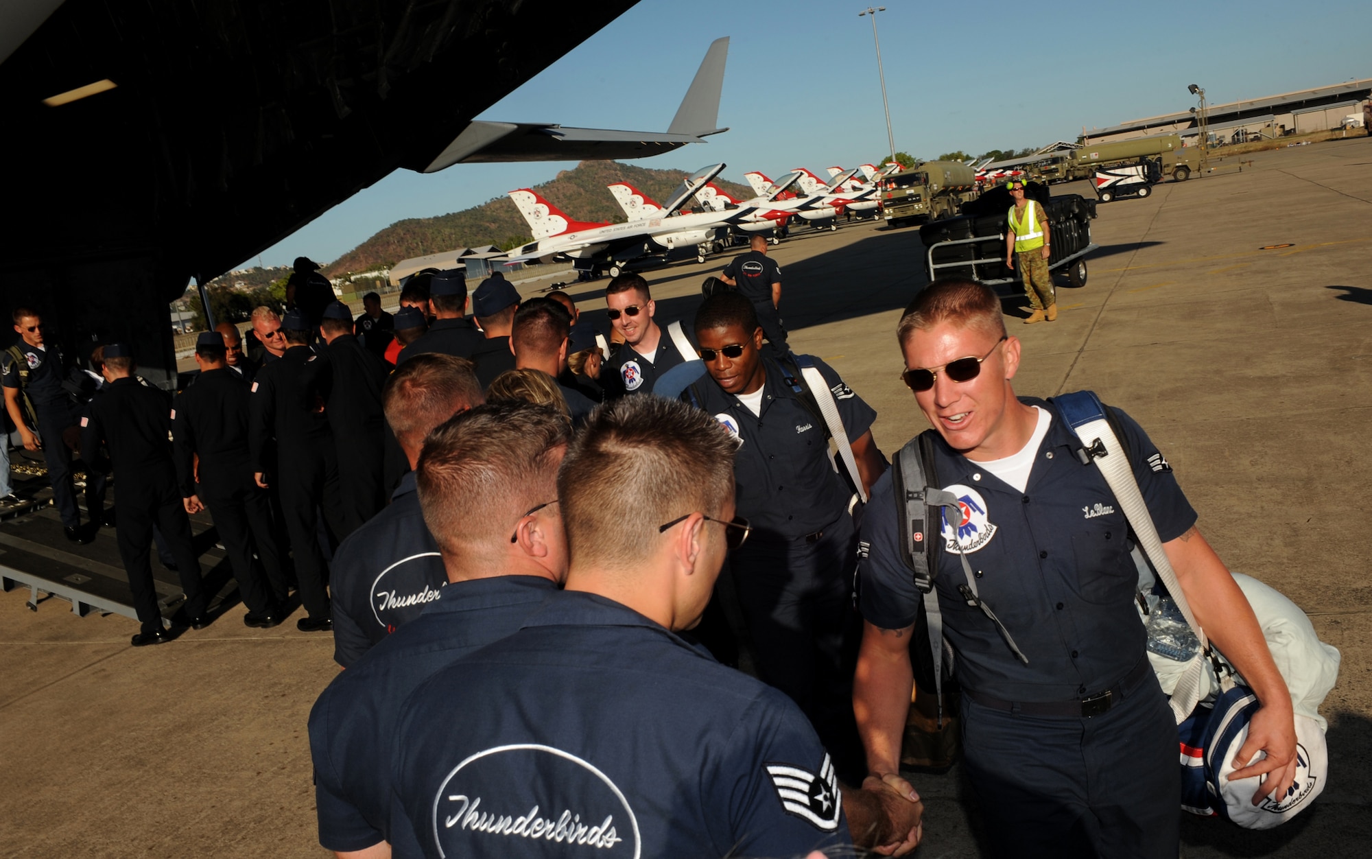 US Air Force Thunderbirds greet one another as the final C-17 lands in Townsville, Australia, Sep. 21, in preparation for a weekend performance. (U.S. Air Force photo/Staff Sgt. Kristi Machado)