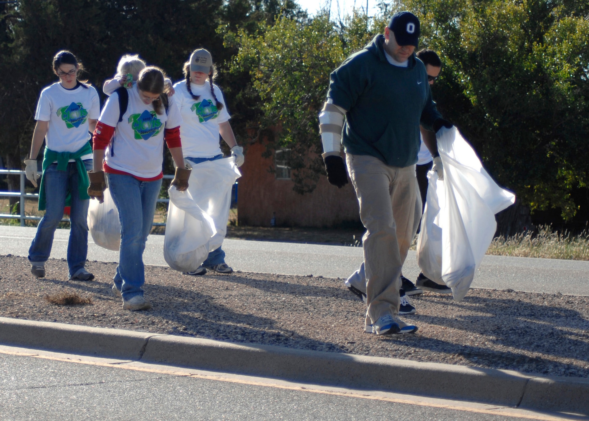 CANNON AIR FORCE BASE, N.M. -- Airmen from the 27th Special Operations Medical Group collect trash during the annual Trek for Trash in Clovis, N.M., Sept. 26. Of the 502 individuals who participated, 240 were from Cannon. (U.S. Air Force photo by Greg Allen)
