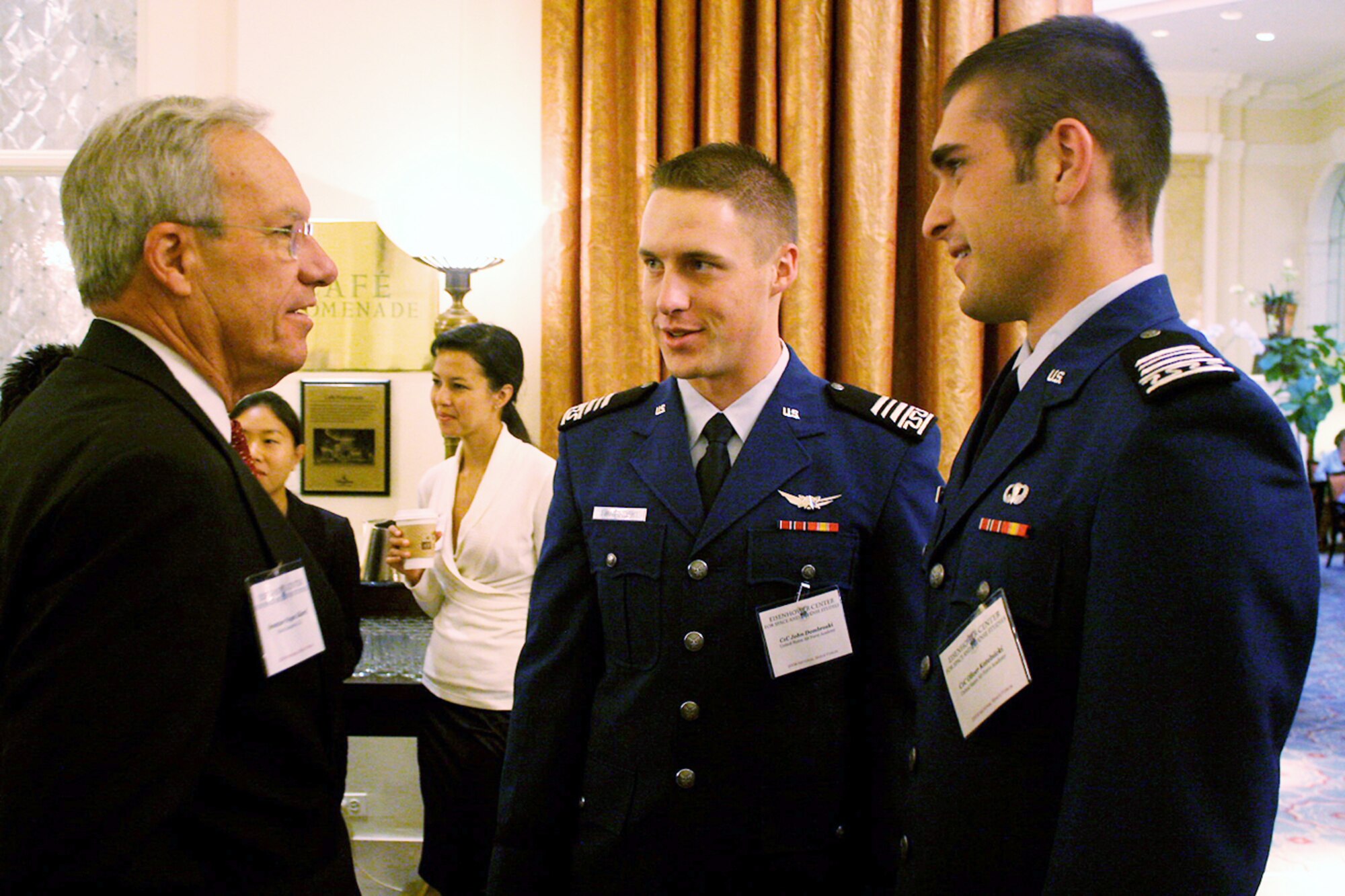 Former Colorado Sen. Wayne Allard, left, talks with Cadets 1st Class John Dombroski and Oliver Kotelnicki during the Project on Strategic Space Issues in Washington, D.C., Sept. 1, 2009. Throughout the three-day event, more than 180 commercial space professionals, former Eisenhower Summer Space Seminar alumni, Air Force Academy cadets and military and government space policy makers addressed U.S. space policy issues. (U.S. Air Force photo)