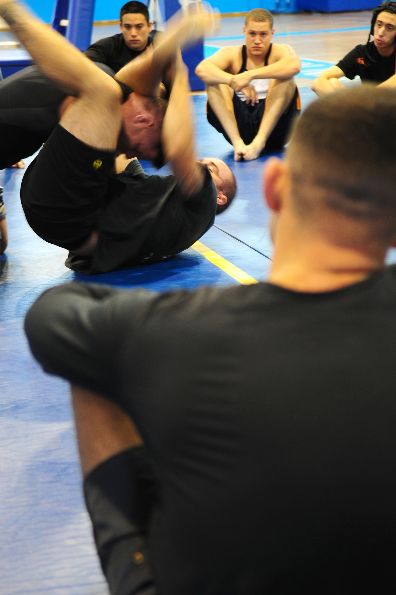Ultimate Fighting Championship fighter Jason 'The Punisher' Lambert (bottom position) and World Extreme Cage fighting fighter Brian Michael Stann (top position) lead an instructional jujitsu session on Ramstein Air Base, Germany, September 28th, 2009. (U.S. Air Force Photo by: Staff Sgt. Jocelyn Rich)