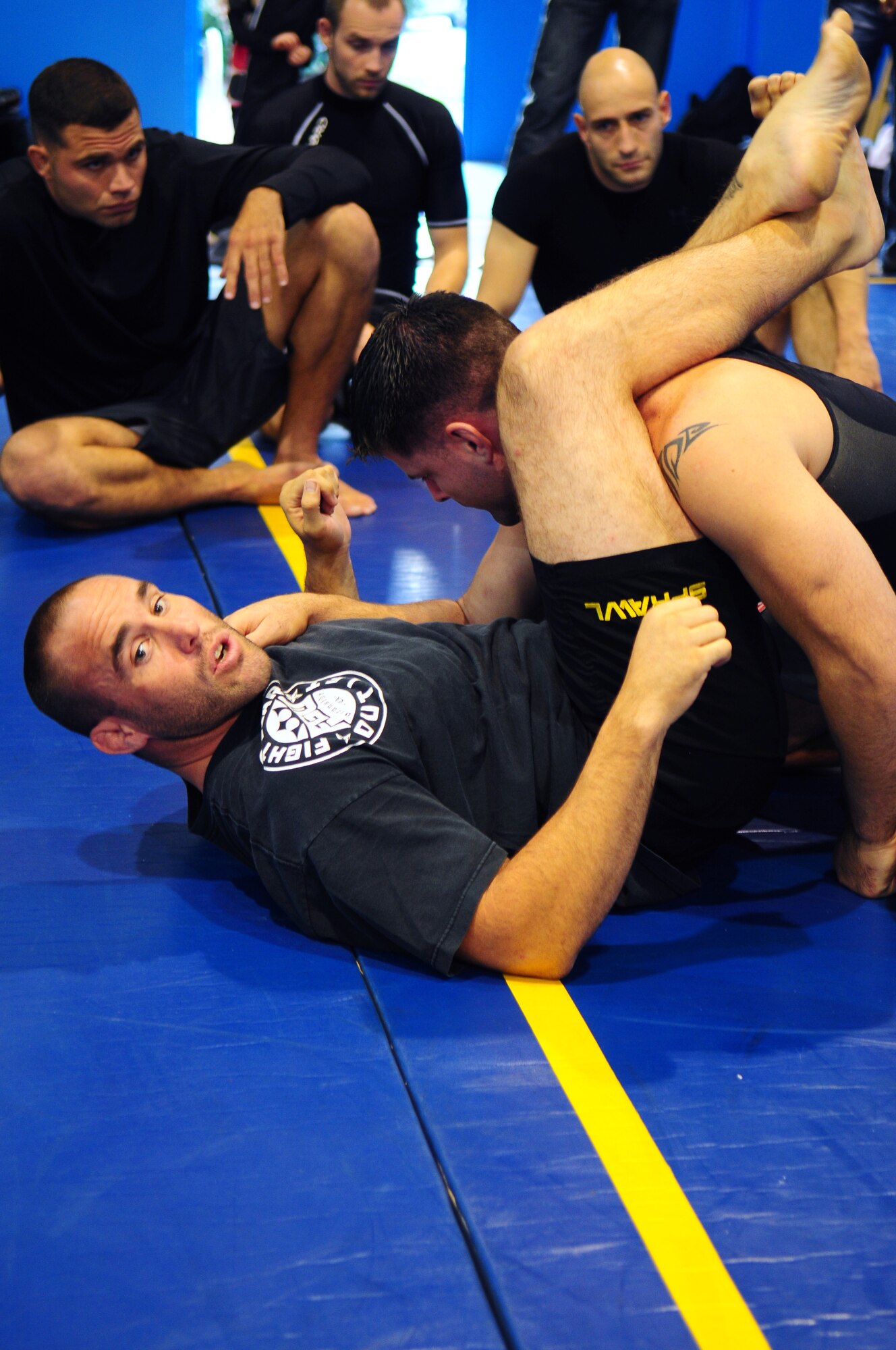 Ultimate Fighting Championship fighter Jason 'The Punisher' Lambert (bottom position) and World Extreme Cage fighting fighter Brian Michael Stann (top position) lead an instructional jujitsu session on Ramstein Air Base, Germany, September 28th, 2009. (U.S. Air Force Photo by: Staff Sgt. Jocelyn Rich)