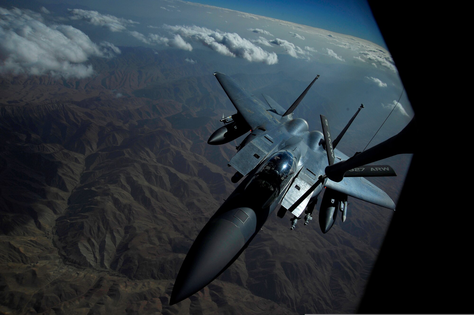An F-15E Strike Eagle is refueled by a KC-135 Stratotanker over Afghanistan on Sept. 25, 2009. The KC-135 is one of Air Mobility Command's leading air refueling aircraft supporting deployed operations for both Operation Enduring Freedom and Operation Iraqi Freedom. (U.S. Air Force Photo/Staff Sgt. Angelita Lawrence)