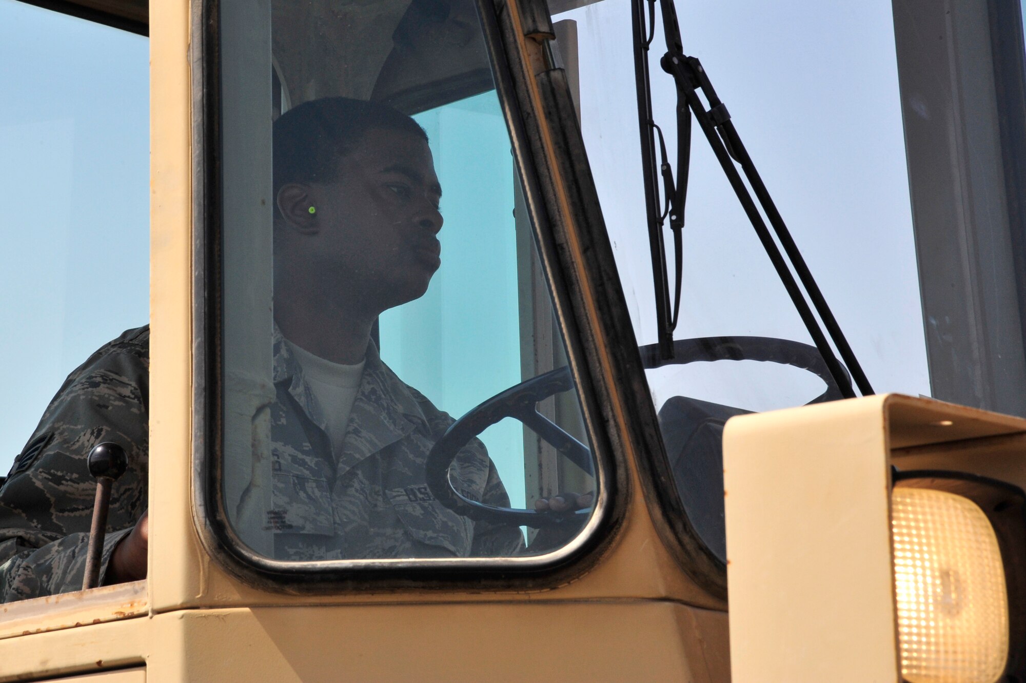 SOUTHWEST ASIA -Staff Sgt. Darryl Fains, 380th Expeditionary Logistics Readiness Squadron, operates a forklift to transload two shipping palettes of equipment here Sept. 29, 2009. Sergeant Fains is deployed from the 914th Airlift Wing, Niagara Falls, N.Y., and hails from Buffalo, N.Y. (U.S. Air Force photo/Tech. Sgt. Charles Larkin Sr)
