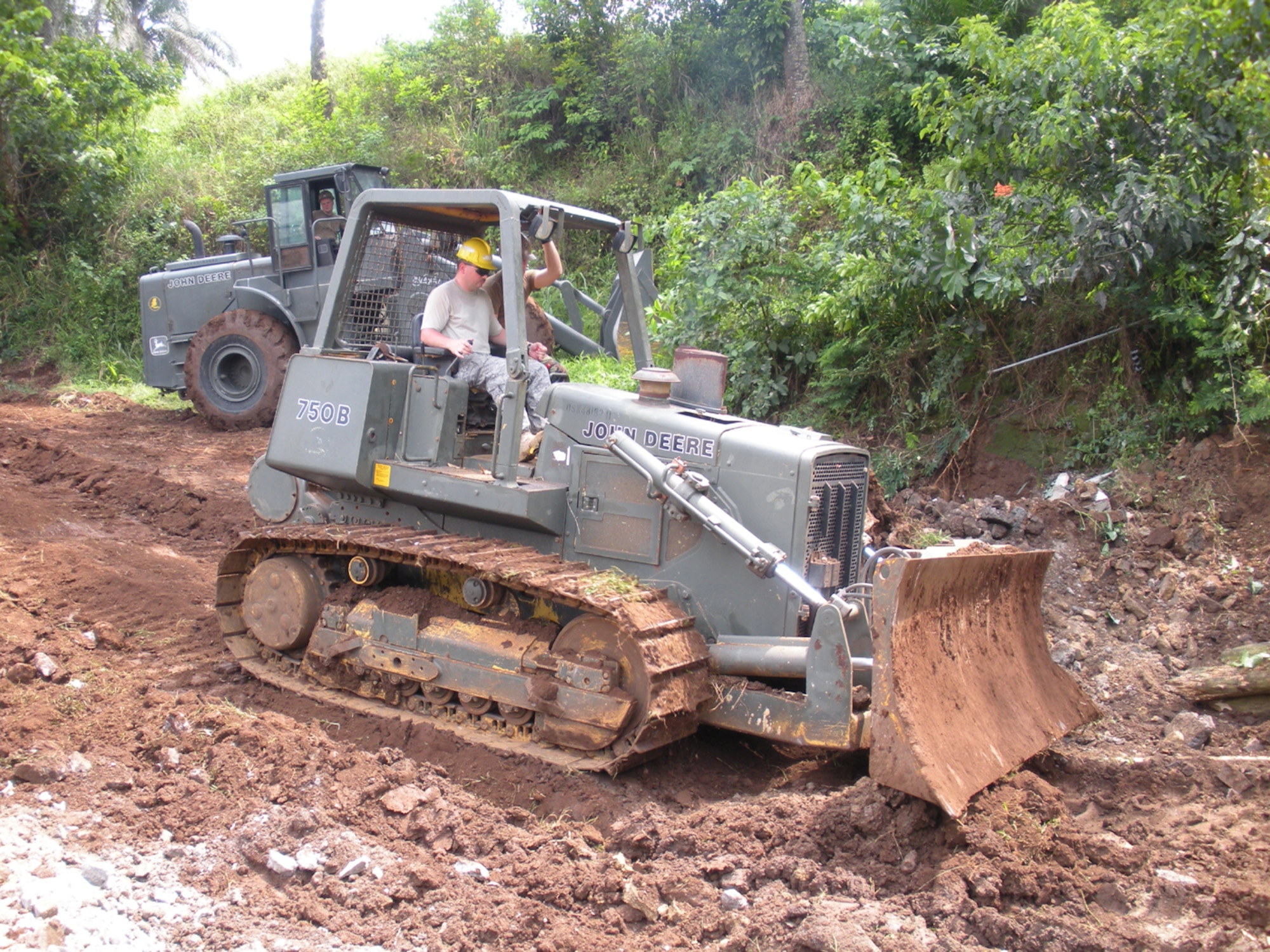 Tech. Sgt. James Gregg,  communication computer system operator with the 21st AMOS, drives a  bulldozer during construction of a pier in support of African Partnership Station 2009. APS 2009 activities consist of multinational joint exercises, port visits, hands-on practical courses, professional training and community outreach with the coastal nations of Africa. (U.S. Air Force photo)


