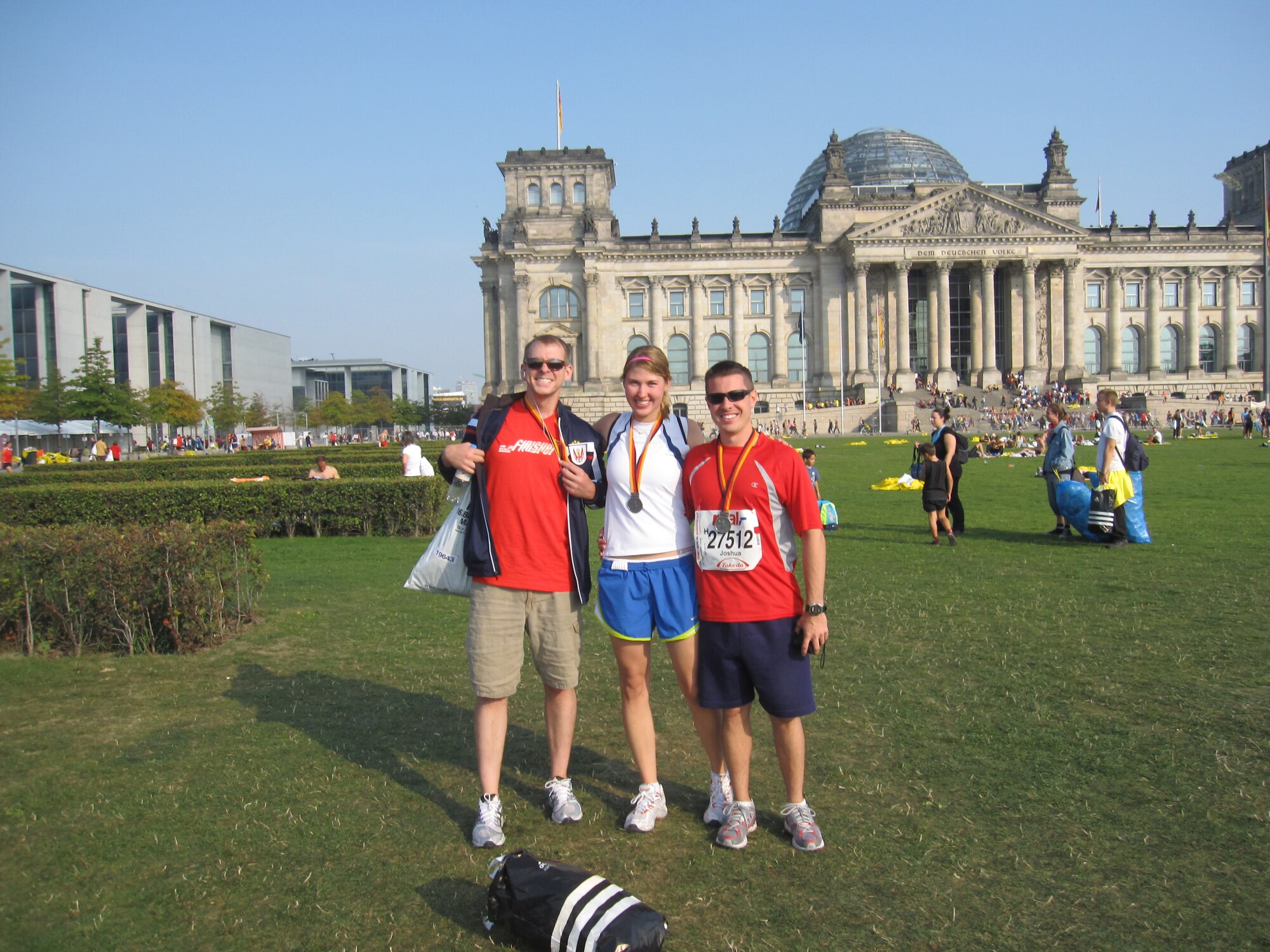 U.S. Air Force First Lt. Wes Manus, Capt. Jen Kissel and 1st Lt. Josh Shaudys pose for a post run photo following the Berlin Marathon Sept. 20. In addition to the
three featured here, several other members from Ramstein participated in the
event: Lt. Col Rick Harper, Capt. Lisa Balas, and Capt. Brock Burkhardt and
his wife Corri.
                               