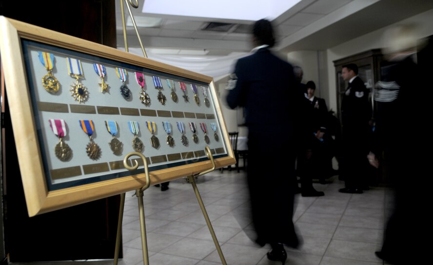 A display of military service medals greets Airmen entering the Air Force Ball Friday, Sept. 25, 2009, at Incirlik Air Base, Turkey. The display was one of many at the ball that highlighted the night’s theme of Heritage, Honor and Valor.(U.S. Air Force Photo/Senior Airman Alex Martinez)