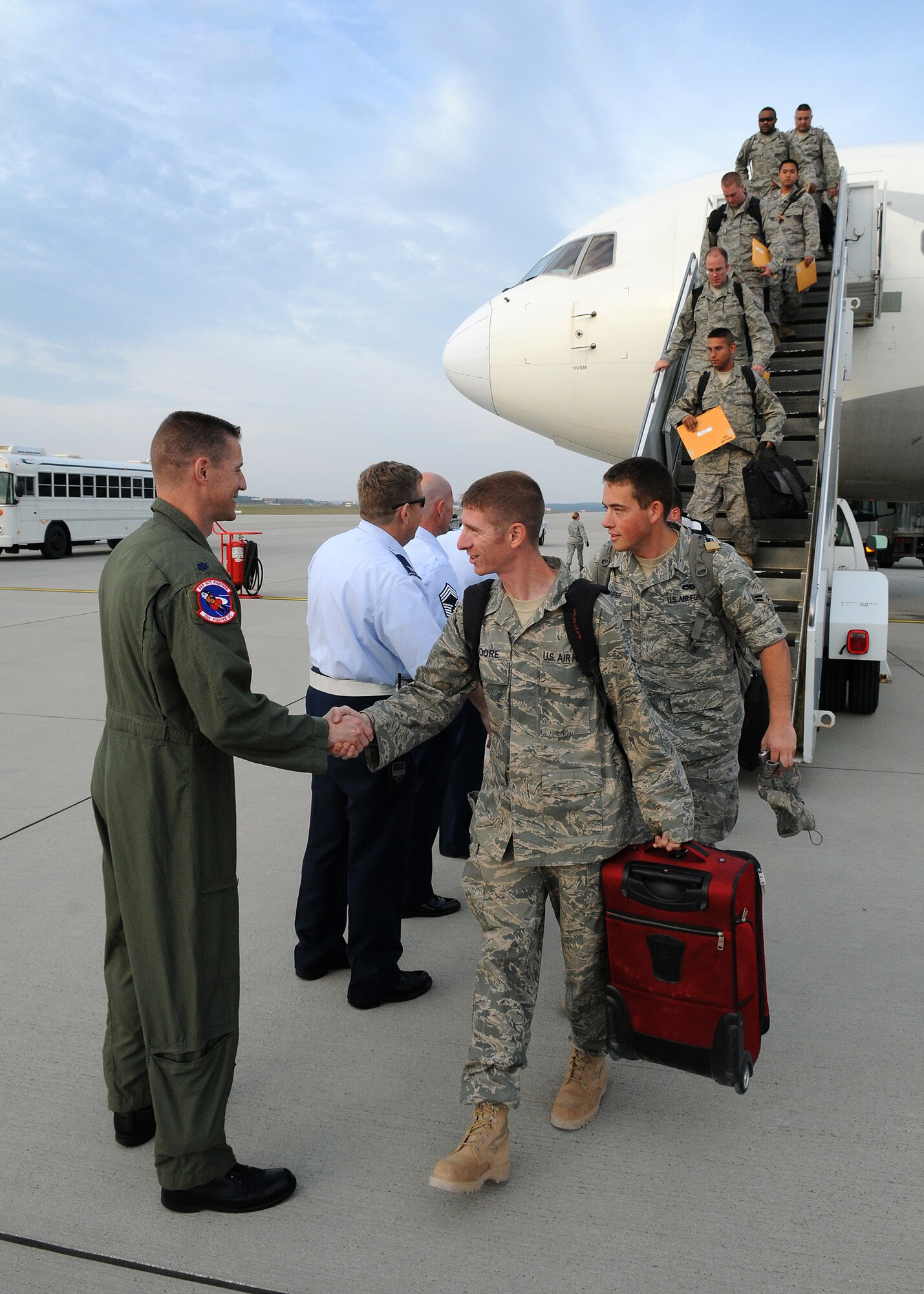 SPANGDAHLEM AIR BASE, Germany - Lt. Col. Douglas Nikolai, 22nd Fighter Squadron commander, greets members of the 52nd Aircraft Maintenance Squadron and 52nd Equipment Maintenance Squadron which returned from a four-month deployment Sept. 28 on the flightline. (U.S. Air Force photo/Airman 1st Class Nathanael Callon)