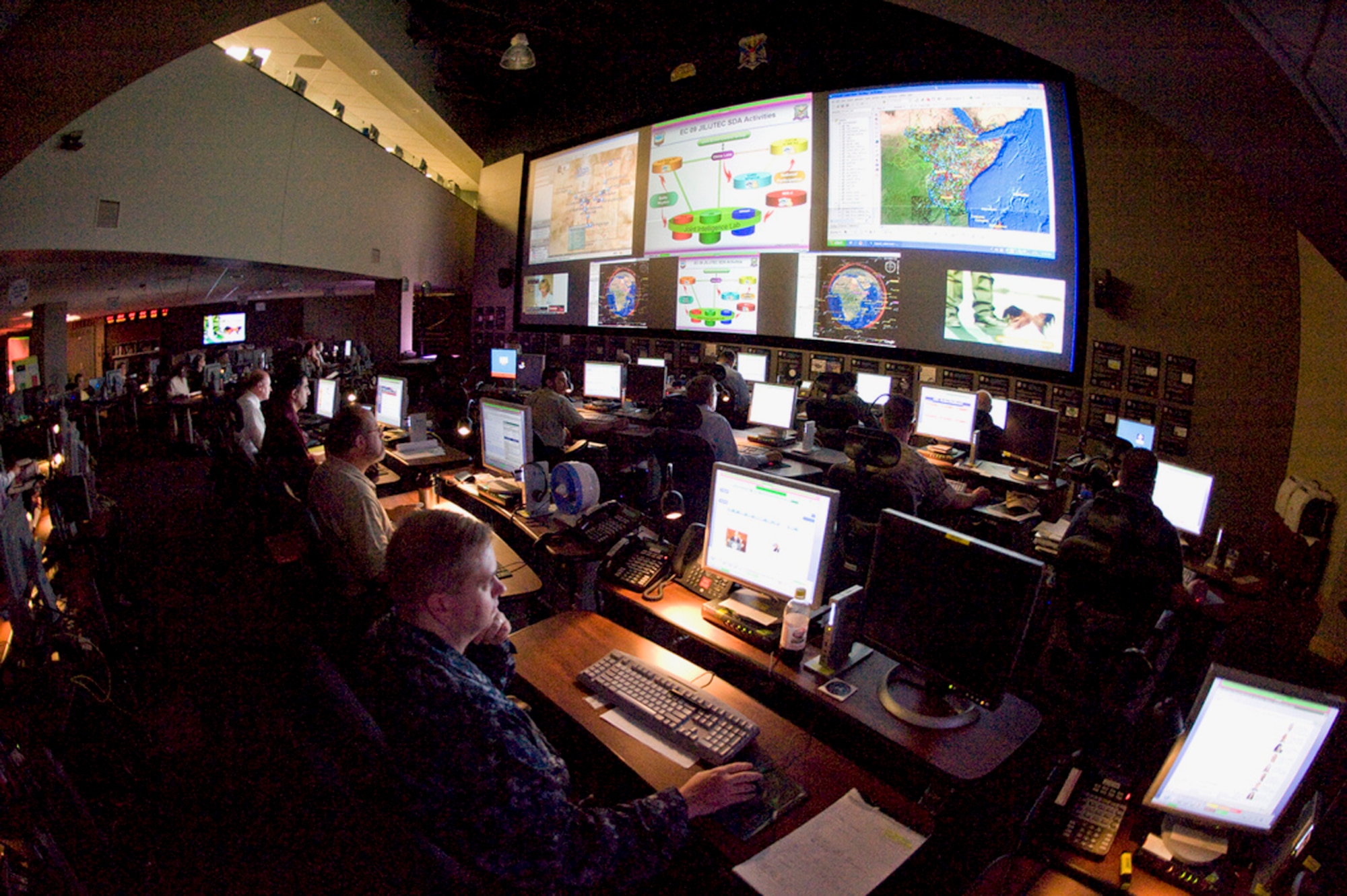 On the operations floor of Exercise Empire Challenge, held at Langley Air Force Base, Va., in 2009, U.S. Air Force, Army, Navy, Marine and military forces from Canada, Australia, New Zealand, France, Germany, and Japan tested interoperability. During the exercise, participants used Cross-Domain Enterprise All-Source User Repository, or CENTAUR, which provides a digital safe space where U.S. and allied nations can link their intelligence-gathering systems and share information, including full motion video, photo imagery, documents and secure chat.  (U.S. Air Force Photo/Tech Sgt. Randy Redman)