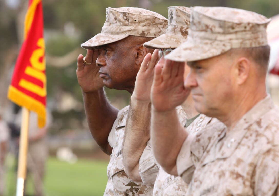 Maj. Gen. Anthony L. Jackson (left), Marine Corps Installations West’s new commanding officer, salutes alongside Lt. Gen. Keith J. Stalder (center), commanding officer, Marine Corps Forces Pacific, and now retired Maj. Gen. Michael R. Lehnert (right), during the Pass-In-Review portion of the MCIWEST change-of-command ceremony at Camp Pendleton, Sept. 29.