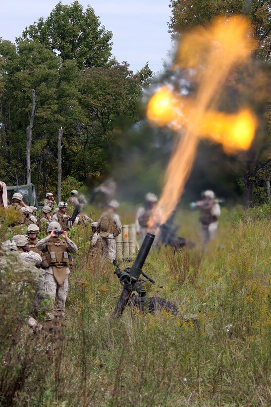 U.S. Marine mortarmen from 120mm mortar platoon, Bravo Battery 1/10, attached to Battalion Landing Team 1st Battalion, 9th Marine Regiment, 24th Marine Expeditionary Unit conduct fire missions during the 24th MEU's Realistic Urban Training at Camp Atterbury, IN September 29, 2009.  The 24th MEU will use these mortarmen in support of BLT 1/9 in hostile areas to neutralize threats by conducting similar fire missions should the need arise while they are on their upcoming deployment. (U.S. Marine Corps photo by Sgt Andrew J. Carlson)