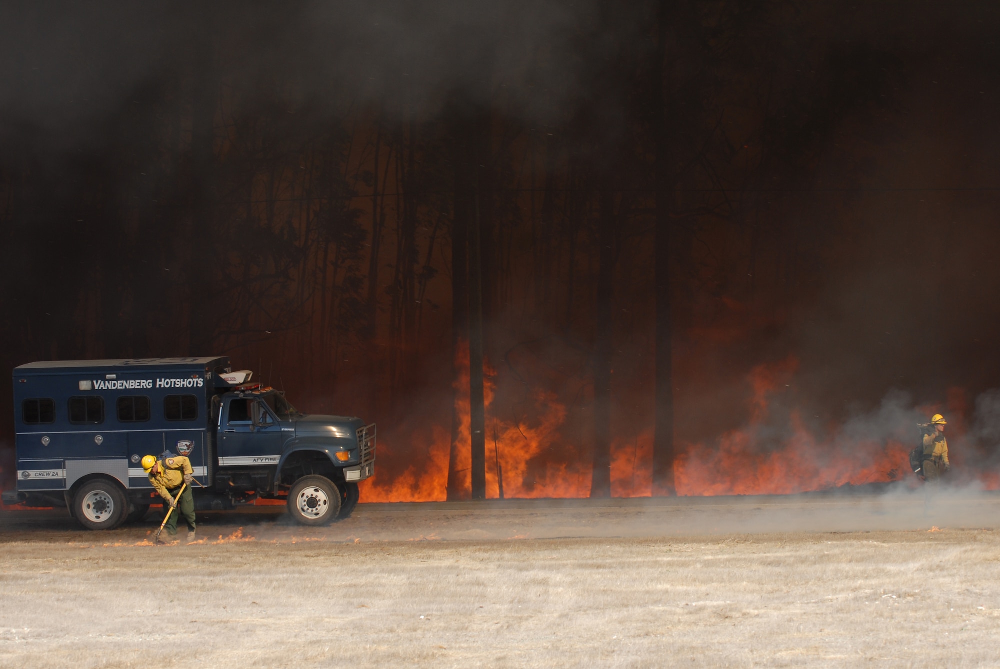 VANDENBERG AIR FORCE BASE, Calif. - Vandenberg Fire and local fire departments respond to a fire started near Vandenberg Middle School  here Sept. 30 at approximately 11:45. Over 350 acres were burned by the fire.  ( U.S. Air Force photo/Senior Airman Antoinette Lyons)