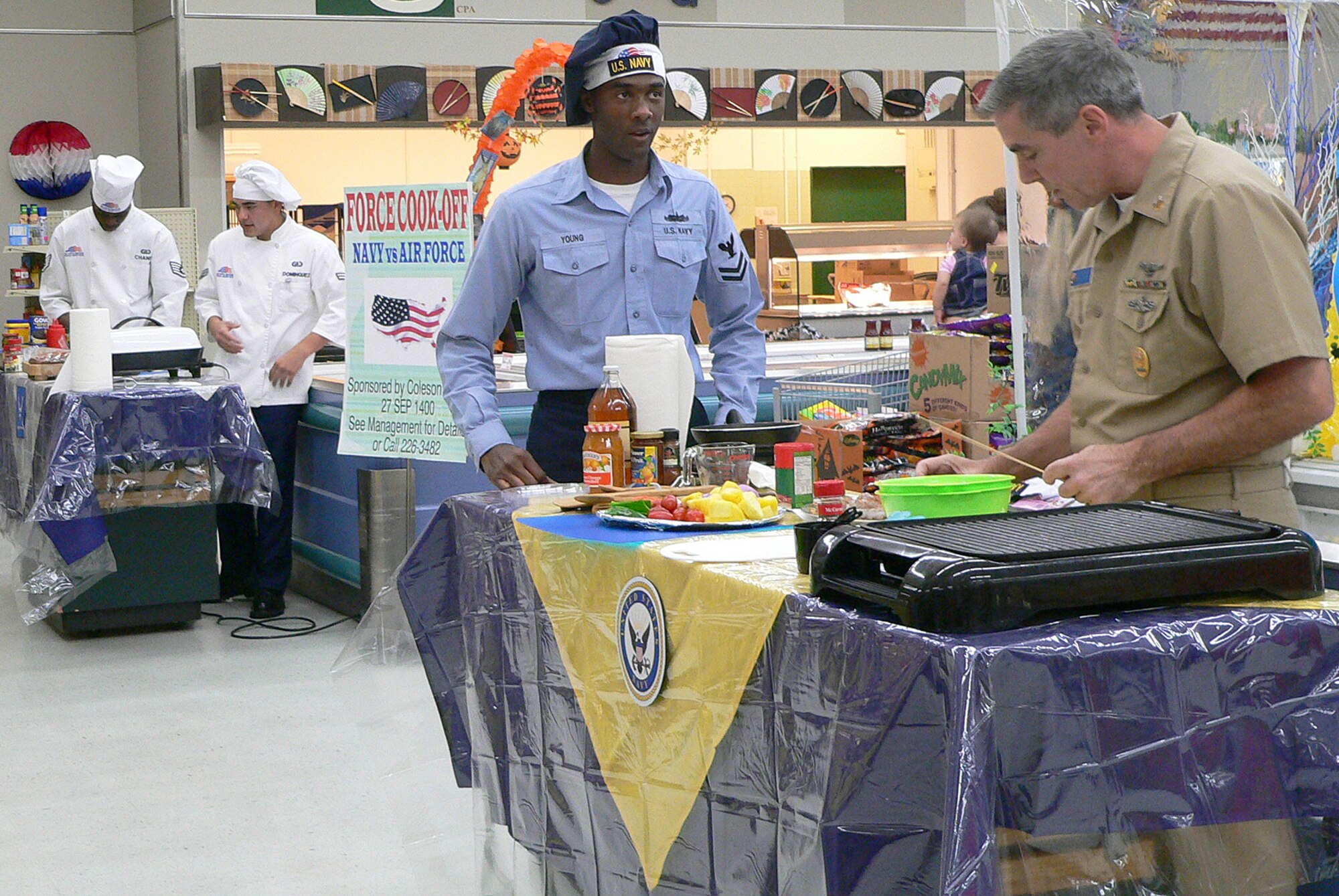 Misawa Air Base, Japan -- The Air Force and Navy squared off with their cooking skills during the Armed Forces cook-off at the base commissary Sept. 27. The theme of the cook-off was mahi-mahi and tilapia, and they had 30 minutes to prepare their signature dishes. (Photo/ Mrs. Satsue Sasaki)